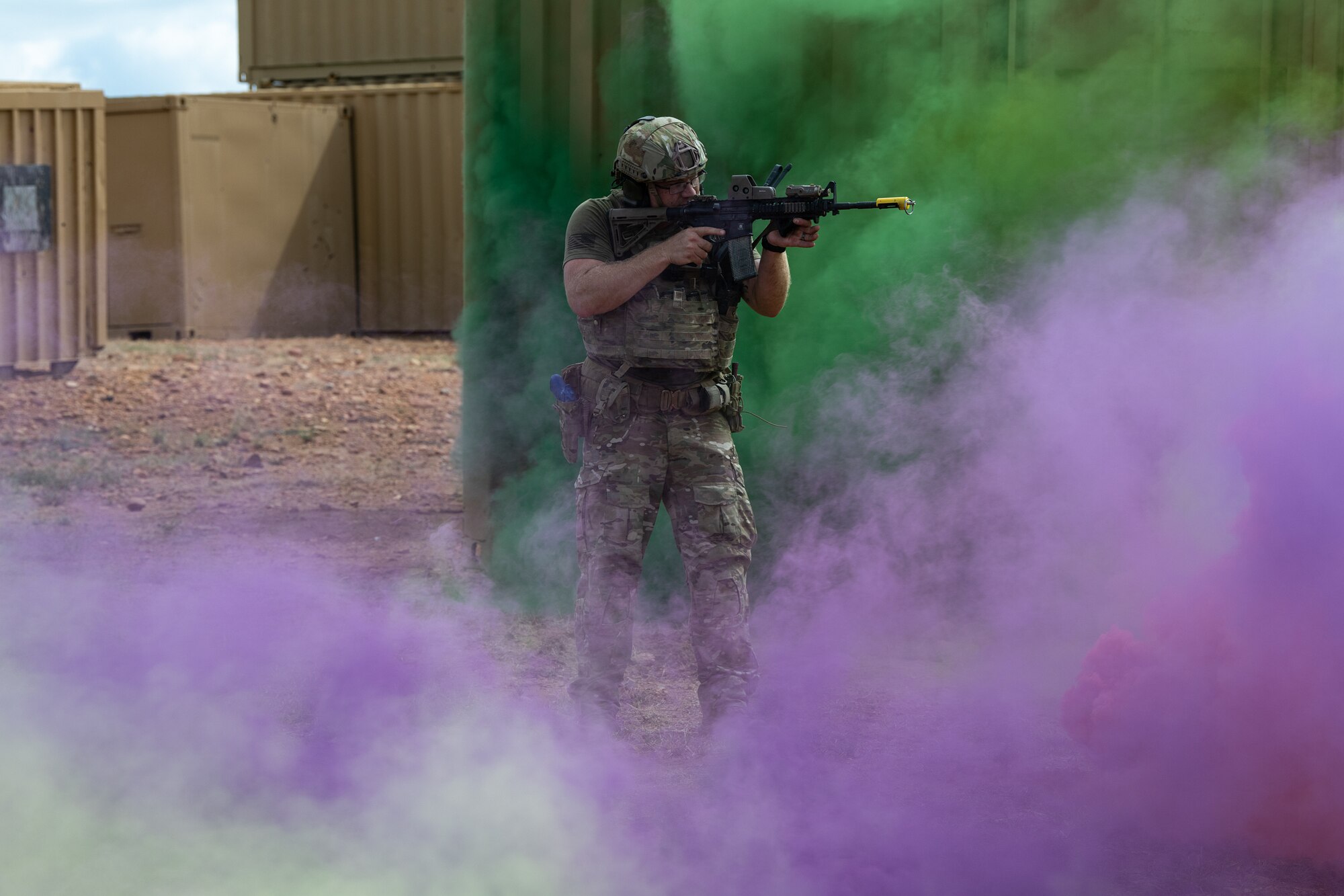 A Joint Terminal Attack Controller of the 137th Special Operations Wing, Oklahoma Air National Guard, stands his ground and returns fire despite the haze. The SENTRY REX 19-02 training mission assault force was supported by E-3AWACS, E-8 J-STARS, MC-12 W Liberty and KC-135 Stratotankers. (Courtesy photo)