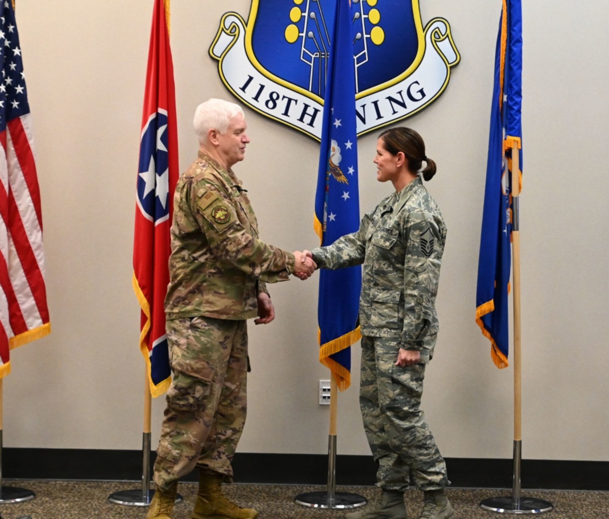 U.S. Air Force Lt. Gen. L. Scott Rice, director of the Air National Guard, coins Master Sgt. Erin Lowell, a supply management technician with the 118th Logistics Readiness Squadron, Dec. 6, 2019 at Berry Field Air National Guard Base, Nashville, Tenn. Rice’s trip to the 118th Wing was his final stop in his visit to all 90 wings in the ANG during his tenure as director. (U.S. Air National Guard photo by Staff Sgt. Anthony Agosti)