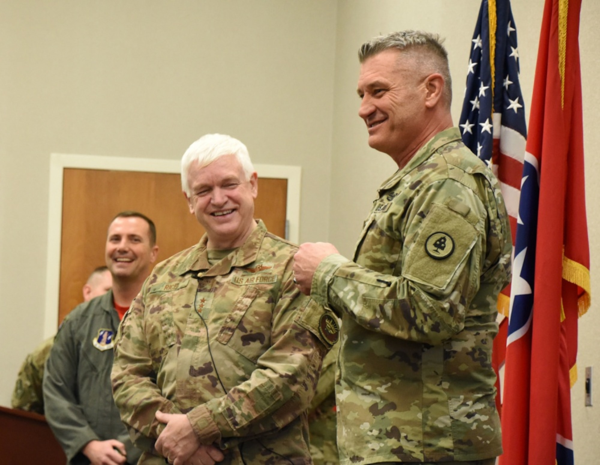 U.S. Army Maj. Gen. Jeff Holmes, right, the adjutant general of the Tennessee National Guard, laughs with U.S. Air Force Lt. Gen. L. Scott Rice, director of the Air National Guard, at an all-call at the 118th Wing, Tennessee ANG, Dec. 6, 2019 at Berry Field Air National Guard Base, Nashville, Tenn. Rice’s trip to the 118th WG was his final stop in his visits to all 90 wings in the ANG during his tenure as director. (U.S. Air National Guard photo by Tech. Sgt. Mark Thompson)