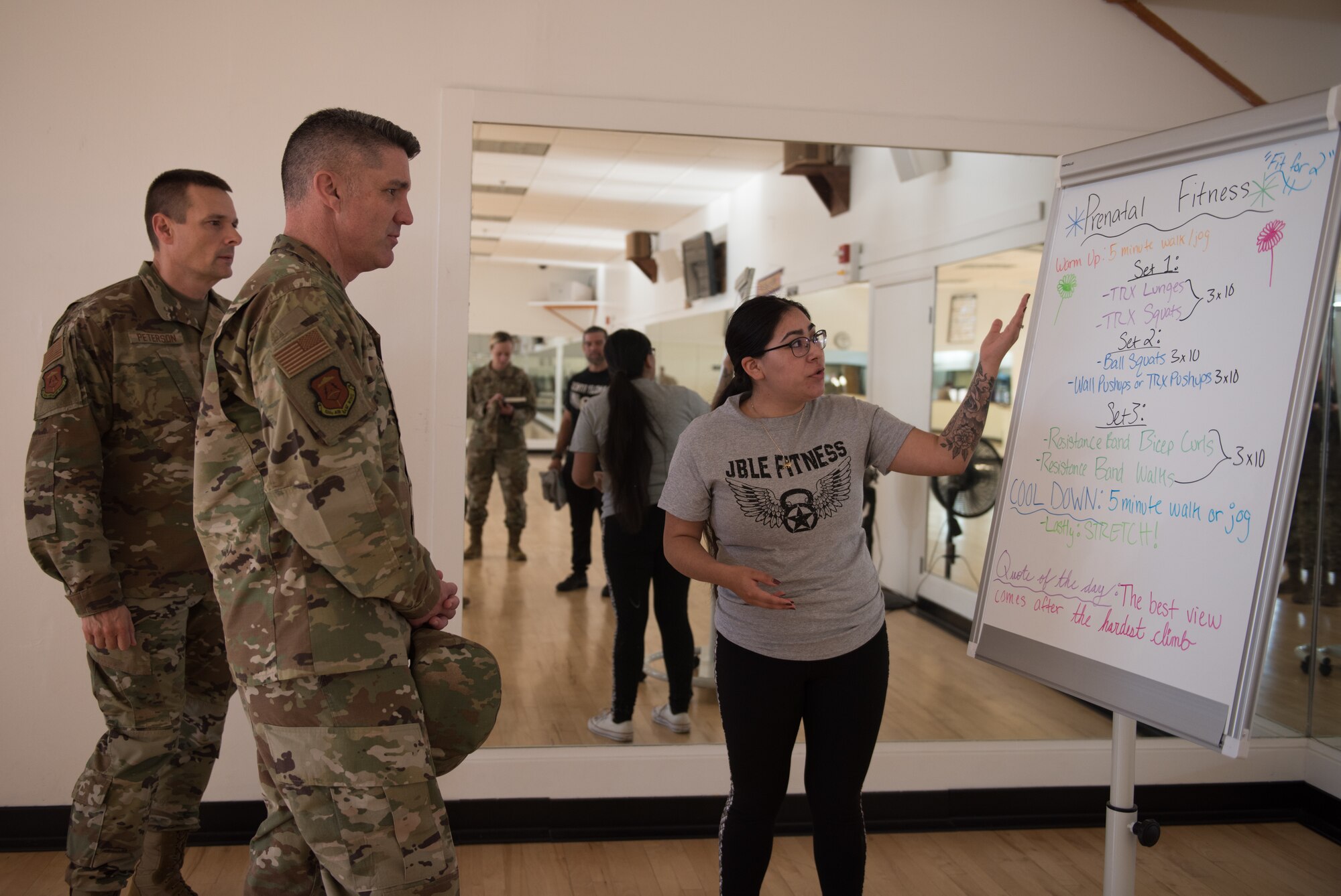 U.S. Air Force Col. Clinton Ross, 633rd Air Base Wing commander, and Chief Master Sgt. Gregory Peterson, 633rd ABW command chief, learn about the prenatal and post-partum programs available at the Air Combat Command gym at Joint Base Langley-Eustis, Virginia, Nov. 25, 2019. During prenatal classes for expectant mothers, consistency is highlighted to improve fitness while maintaining a reasonable level of effort. (U.S. Air Force photo by Airman 1st Class Sarah Dowe)