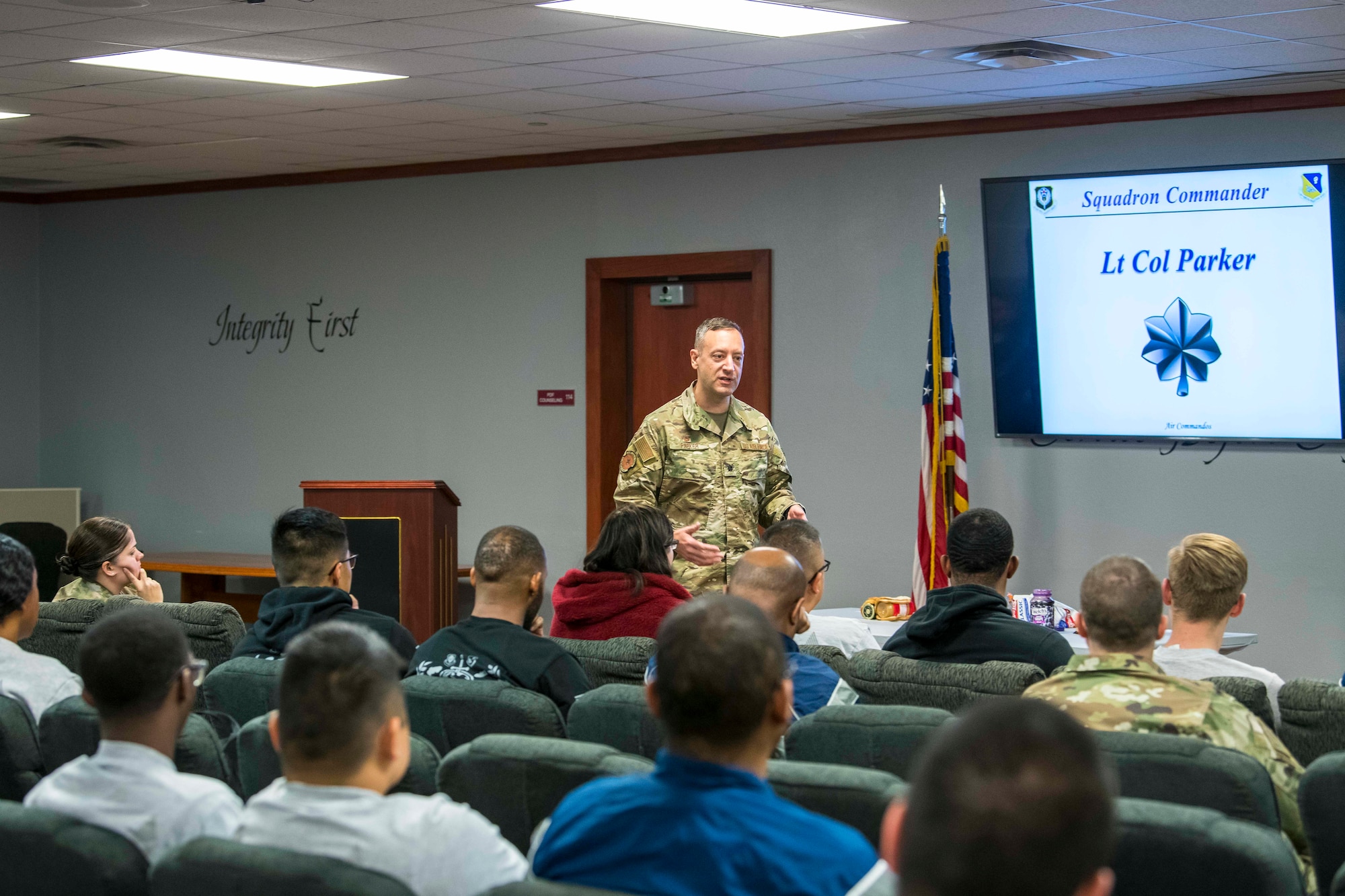 Lt. Col. Shaun Parker, 27th Special Operations Logistics Readiness Squadron commander, speaks to members of his squadron about the importance of mental health during the Individuals Caring Attitude Resiliency and Empowerment event at Cannon Air Force Base, N.M., Dec. 6, 2019. Leadership from the 27 SOLRS tasked the ICARE team with creating an open forum for members to learn about mental health. (U.S. Air Force photo by Senior Airman Vernon R. Walter III)
