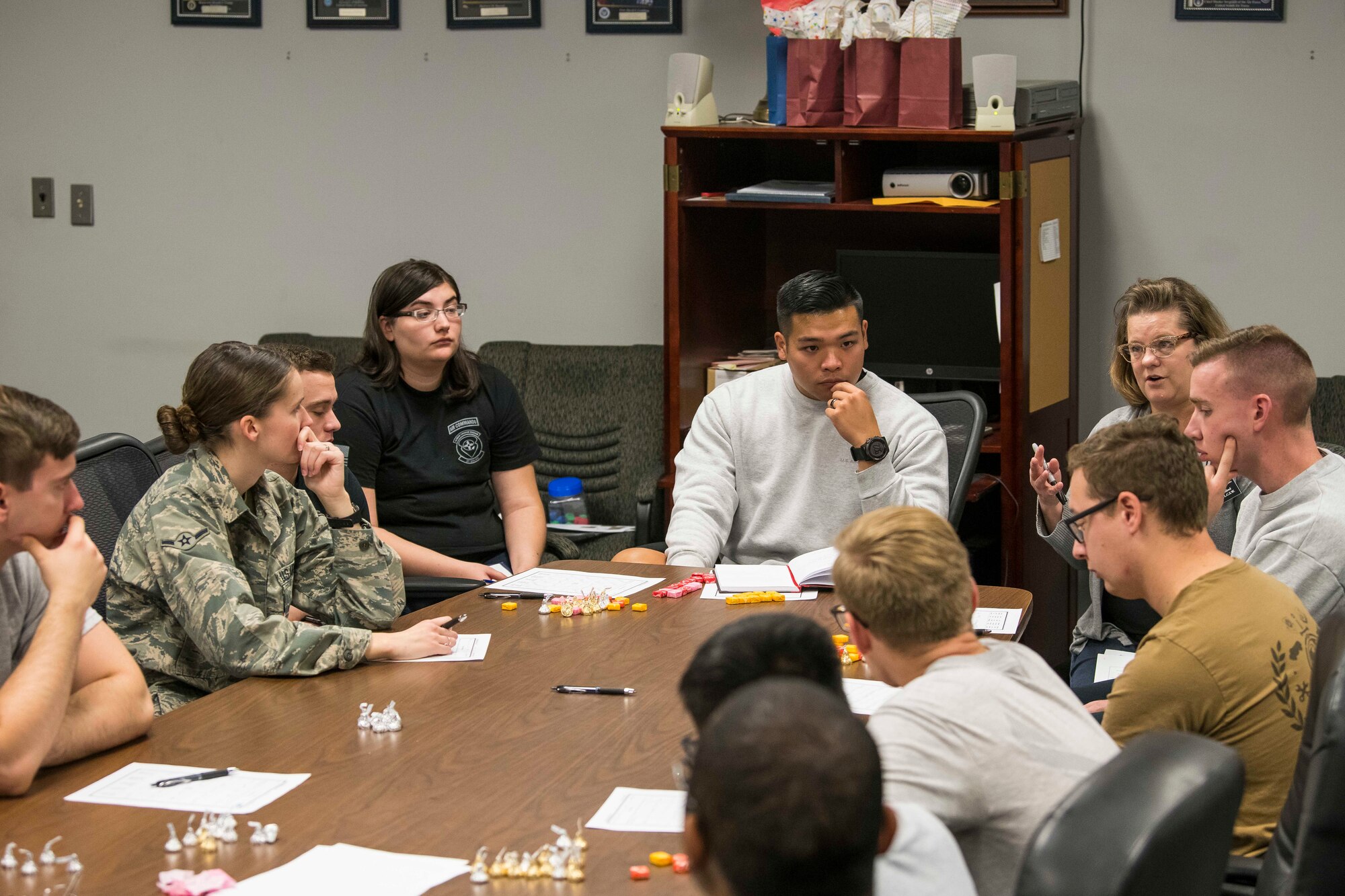 Members of the 27th Special Operations Logistics Readiness Squadron share stories with each other during the Individuals Caring Attitude Resiliency and Empowerment event at Cannon Air Force Base, N.M., Dec. 6, 2019. During the meeting, members were given the opportunity to share their stories with others in a safe space. (U.S. Air Force photo by Senior Airman Vernon R. Walter III)