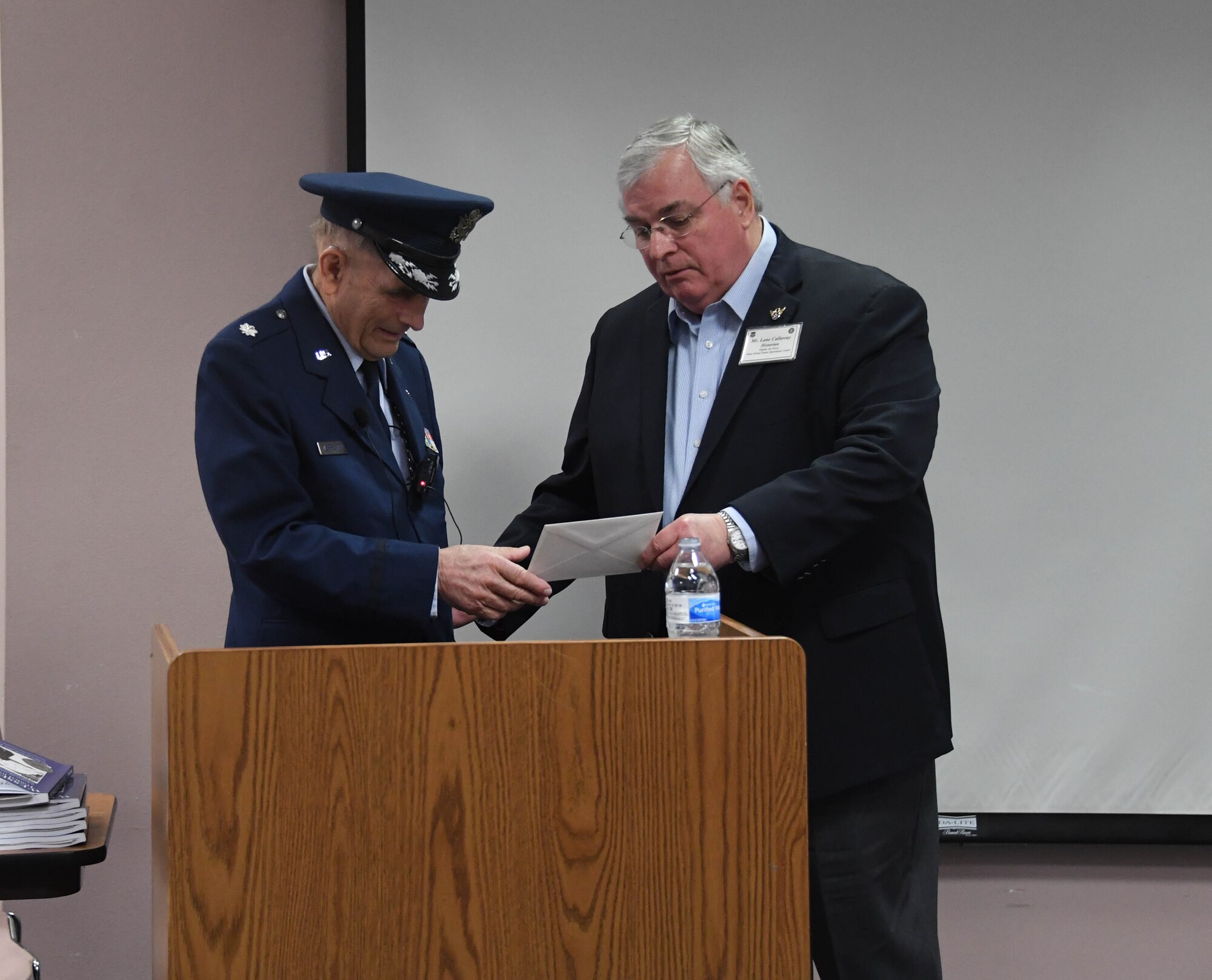 U.S. Air Force Lt. Col. Adolf Wesselhoeft tells what is was like growing up during the World War II and later as a member of 8th Air Force during a presentation at the History Center in Bossier City, La., Dec. 8, 2019. As a child of German immigrants (but born an American citizen), he and his parents were made to live in a U.S. internment camp during WW II until they were forced to return to Germany where they weathered severe bombings in Hamburg. Later on, Wesselhoeft returned to the U.S. and joined the military. He served as a photographer, navigator as well as a B-52 electronic warfare officer. He flew combat missions during the Vietnam War in the same unit (8th Air Force) that he lived through during WW II. Following Wesselhoeft' s address at the center, Lane Callaway, 8th Air Force historian, presented the veteran a letter of appreciation from Maj. Gen. James Dawkins Jr, current 8th Air Force commander, for his dedication and career service. (U.S. Air Force photo by Justin Oakes)