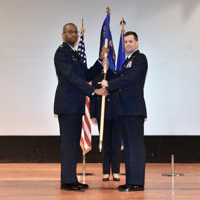 Lt. Col. Steven C. Rotz, right, accepts command of the 655 Intelligence, Surveillance, and Reconnaissance Wing, 64th Intelligence Squadron, from the 655th ISR Group commander, Col. Ricardo T. Baker, during a ceremony at Wright-Patterson Air Force Base, Ohio, Dec. 8, 2019.  Colonel Rotz joined the Air Force in 1988 as an aerospace medicine technician and commissioned as an officer in 2002. (Photo by Maj. John T. Stamm 655 ISR Wing Public Affairs)