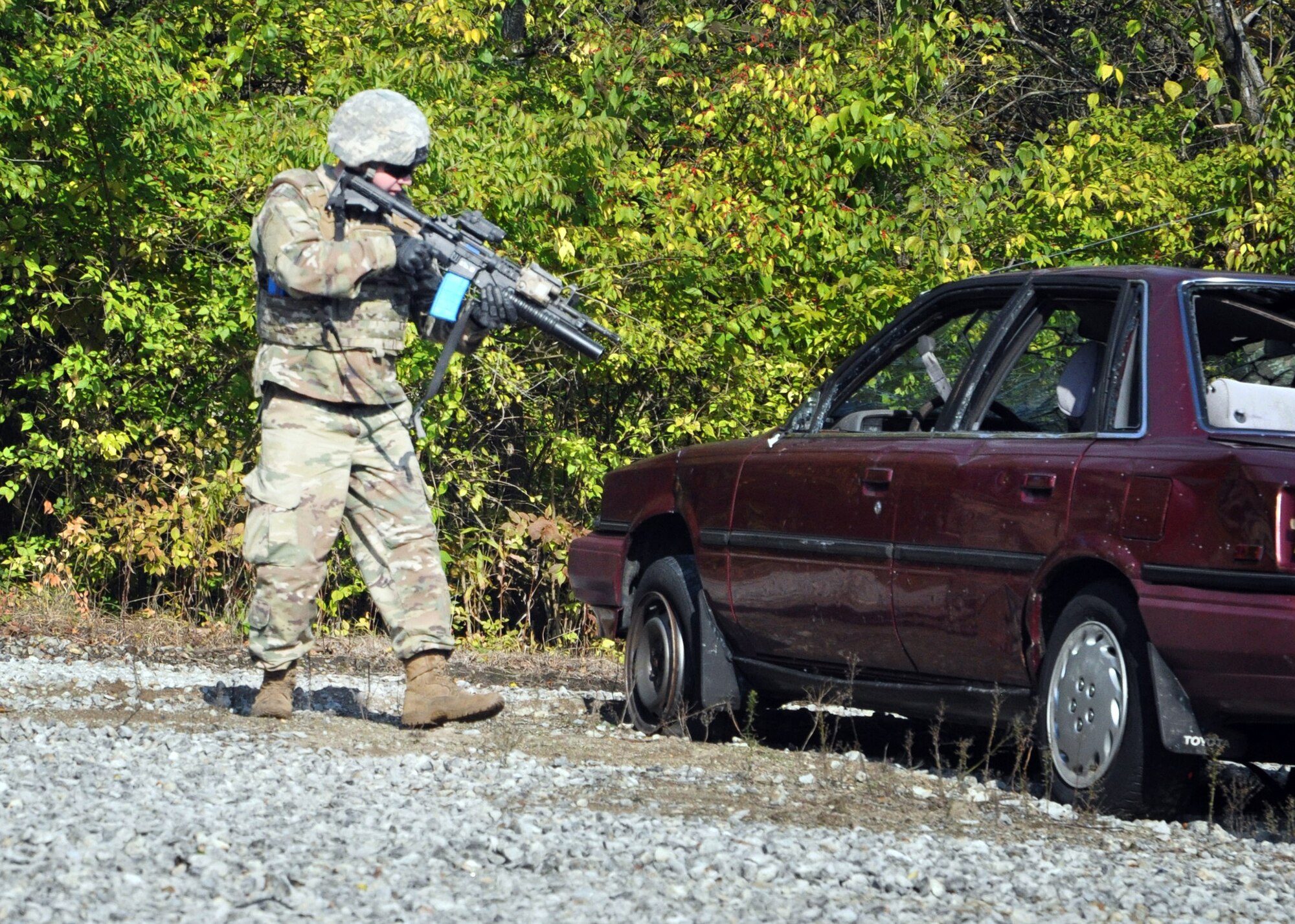 Staff Sgt. Justin Daley, 445th Security Forces Squadron, works as part of a team to clear a training vehicle at the Warfighter Training Center on Wright-Patterson Air Force Base, Ohio, Nov. 2, 2019.