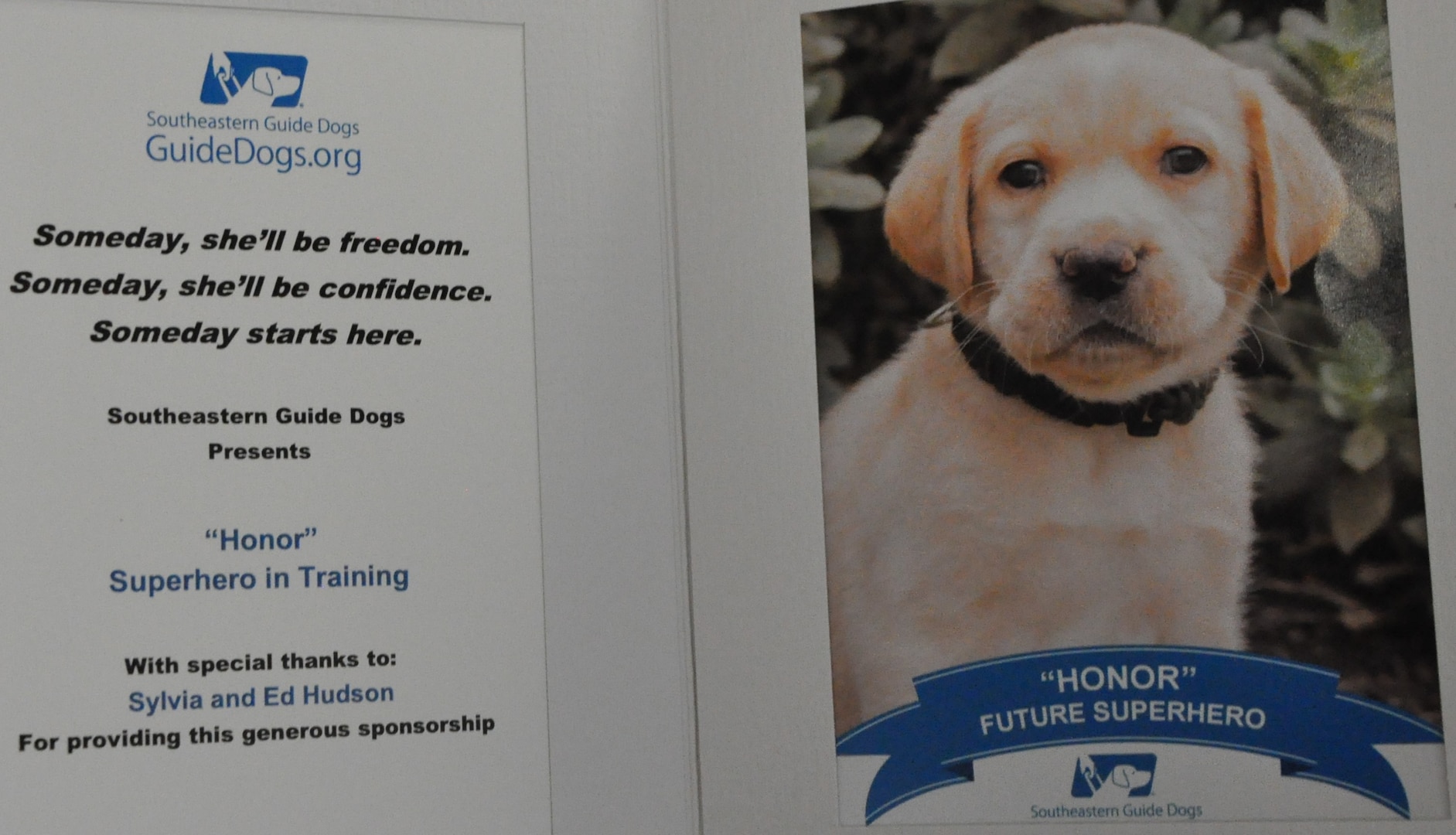 IMAGE: DAHLGREN, Va. (Dec. 11, 2019) – Honor was a ‘Superhero in Training’ thanks to Ed and Sylvia Hudson, who have raised her through the Southeastern Guide Dogs’ tele-raiser program. Hudson – Cyber Technologies and Software Systems Division head at Naval Surface Warfare Center Dahlgren Division – and his wife have raised guide dogs through the nonprofit in Florida for more than a decade. (U.S. Navy photo/Released)