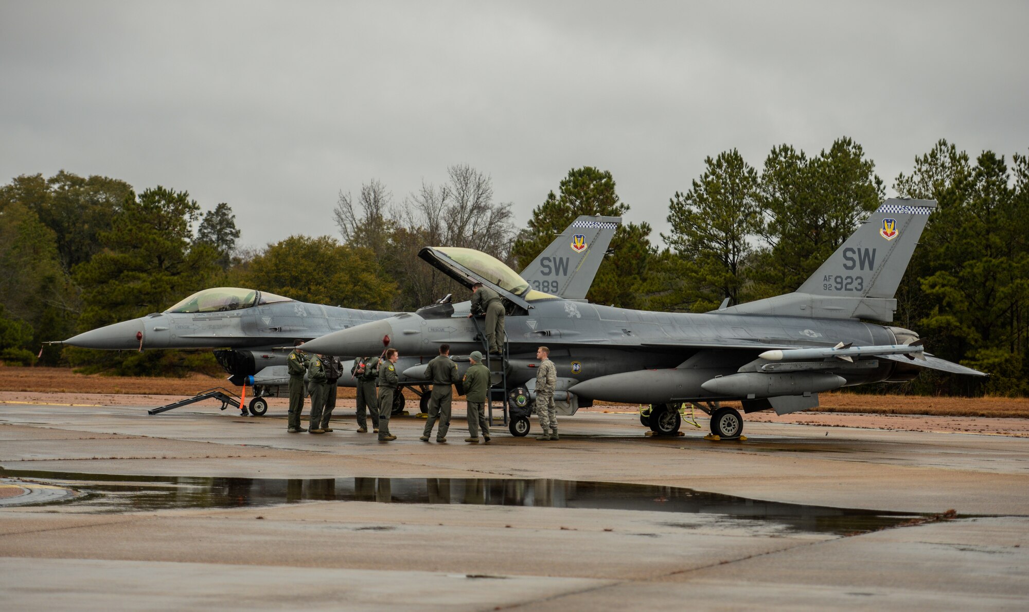 Airmen line up to view the interior of an F-16 Fighting Falcon Dec. 10, 2019, at Columbus Air Force Base, Miss. Since Sept. 11, 2001, the F-16 has been a major component of the combat forces committed to the war on terrorism flying thousands of sorties in support of operations Noble Eagle (Homeland Defense), Enduring Freedom in Afghanistan and Iraqi Freedom. (U.S. Air Force photo by Airman Davis Donaldson)