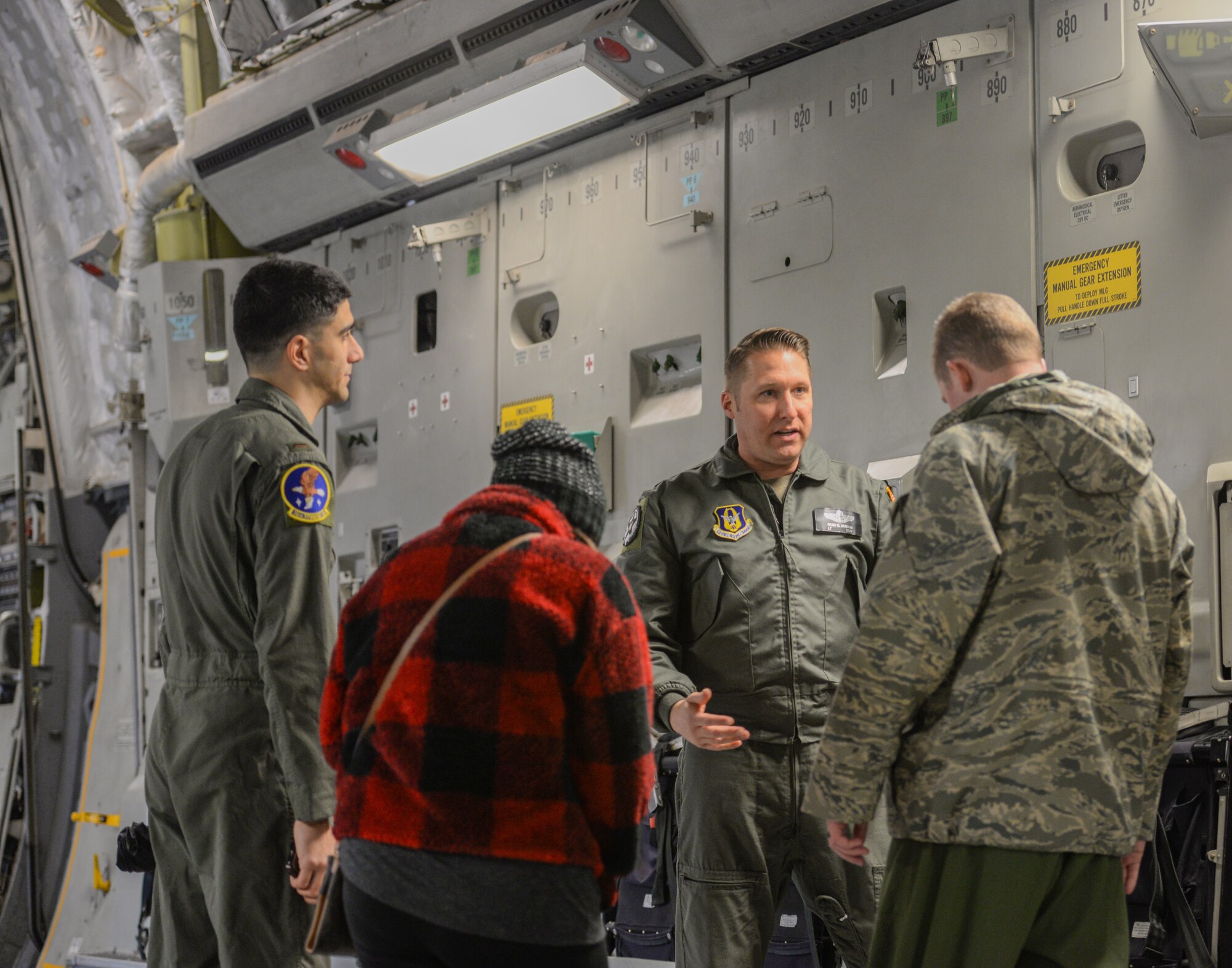 Airmen talk with a member of the aircrew of a C-17 Globemaster III Dec. 10, 2019, at Columbus Air Force Base, Miss. The aircraft is operated by a crew of three Airmen (pilot, co-pilot and loadmaster), reducing manpower requirements, risk exposure and long-term operating costs. (U.S. Air Force photo by Airman Davis Donaldson)