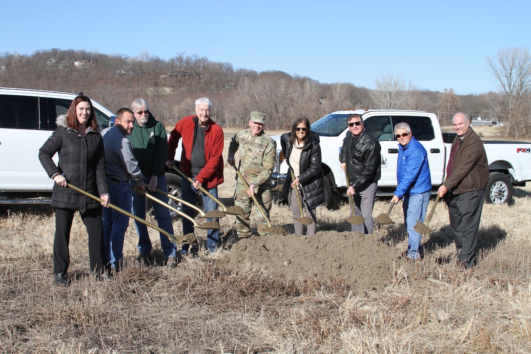 Leaders who helped bring the Parkville Bottoms Project to fruition on the banks of the Missouri River in Parkville, Mo. break the ground on construction December 11, 2019. The project will have over 40 acres of restored wetland on over 100 acres of land with walking trails traversing it.
