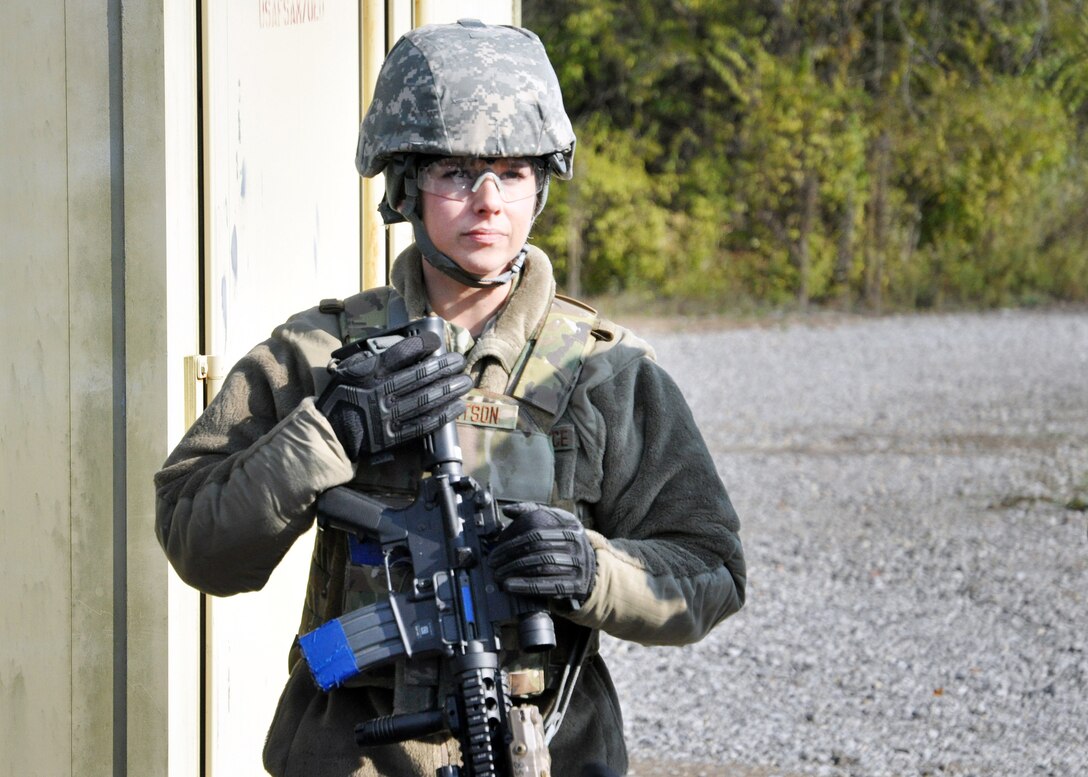 Staff Sgt. Brittany Robertson, 178th Security Forces Squadron, Springfield Air National Guard Base, Ohio, watches intently for a hand signal from her teammates during shoot, move, communicate training at the Warfighter Training Center on Wright-Patterson Air Force Base, Ohio.