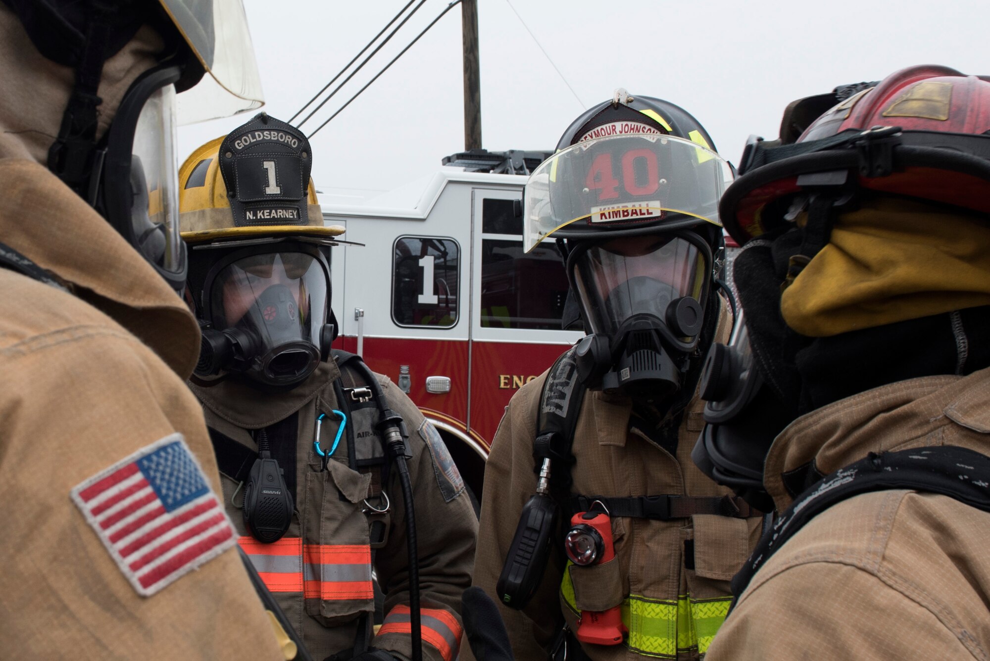 Members of the 4th Civil Engineer Squadron and the Goldsboro Fire Department, receive a brief prior to conducting decontamination procedures during a Hazardous Material Spill Response exercise, Dec. 9, 2019, in Goldsboro, N.C.