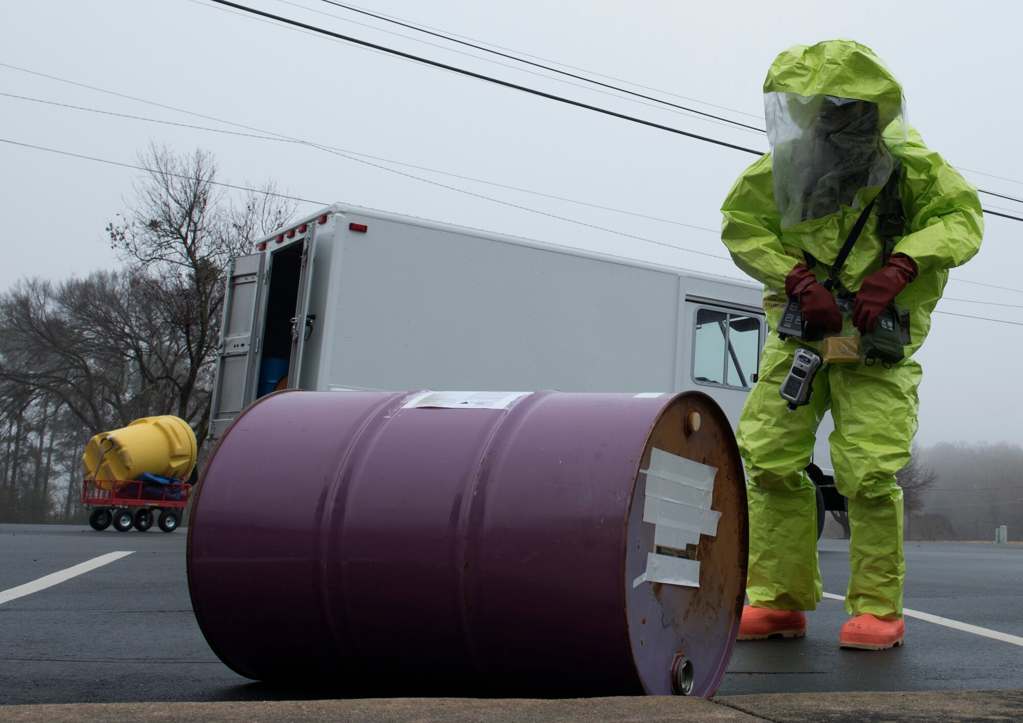 Airman 1st Class Cameron Butler, 4th Civil Engineer Squadron emergency management hazardous material team technician, examines a drum during a Hazardous Material Spill Response exercise, Dec. 9, 2019, in Goldsboro, N.C.