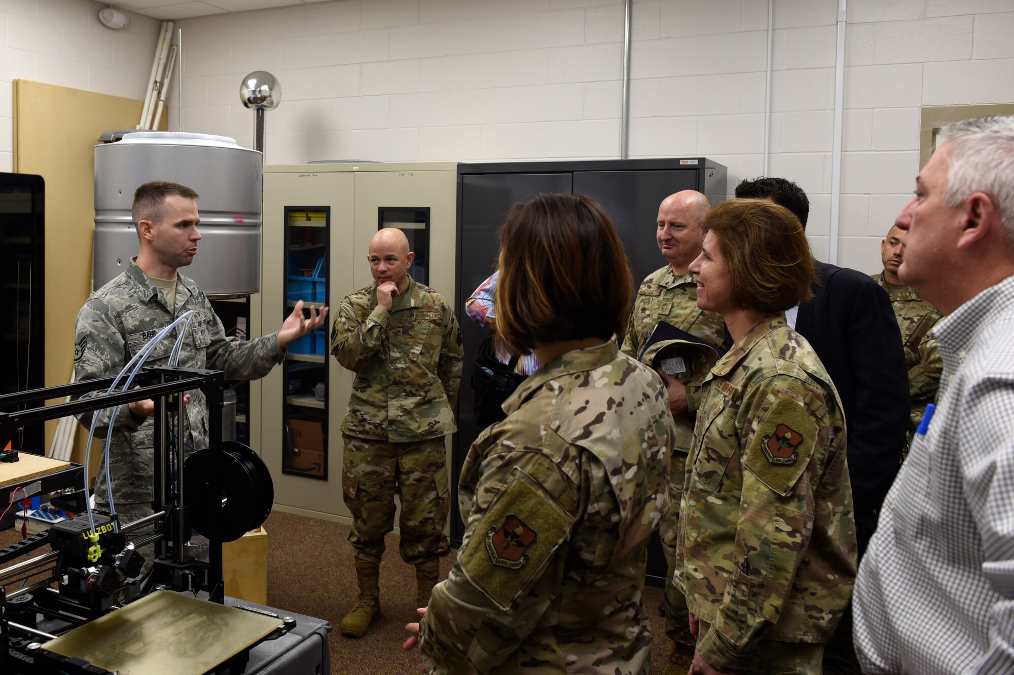 U.S. Air Force Staff Sgt. Jonathan Bahr, 312th Training Squadron Special Instrument Training instructor, speaks to Maj. Gen. Andrea Tullos, 2nd Air Force commander, and leadership during a tour of the Special Instrument Training’s Neural Optimization via Application lab at the Louis F. Garland Department of Defense Fire Academy, Nov. 20, 2019. The NOVA lab lets students get hands-on experience with 3-D printers, programming computers and real life application of their lessons. (U.S. Air Force photo by Airman 1st Class Zachary Chapman)