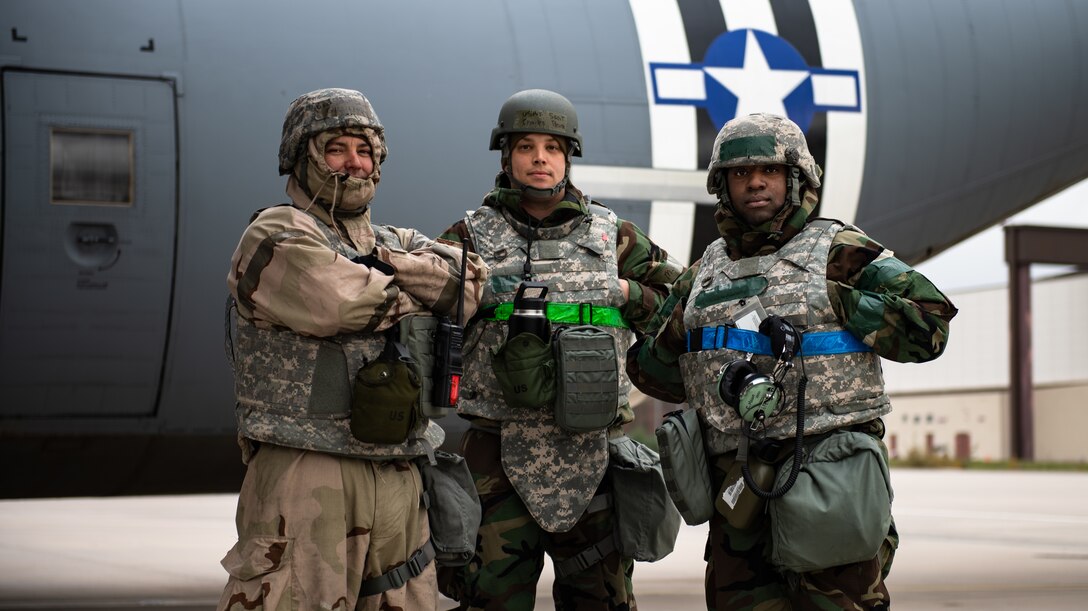 U.S. Air Force Tech. Sgt. David Gilliland, left, Staff Sgt. Charles Pearce, center, and Staff. Sgt. Christopher Mason, right, 86th Aircraft Maintenance Squadron engine specialists, pose for a photo during exercise Operation Varsity 19-04 at Ramstein Air Base, Germany, Dec. 10, 2019. The use of Mission-Oriented Protective Posture gear allows the maintainers to endure potential crises so the mission can continue with minimal delays. (U.S. Air Force photo by Staff Sgt. Devin Boyer)