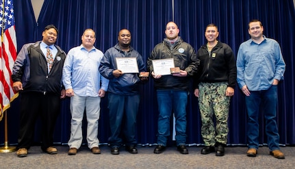 Mechanical Group (Code 930) Boiler Shop (Shop 41) mechanics Larry Montgomery (center left) and James Yung (center right) were recognized as the Third Quarter Cleanliness Warriors for their continuous efforts in cleanliness as well as their efforts as part of the USS George H.W. Bush (CVN 77) project. Both recepients were awarded a certificate of achievement, a Cleanliness Warrior sticker, a service award, and a C.O.R.E. award.