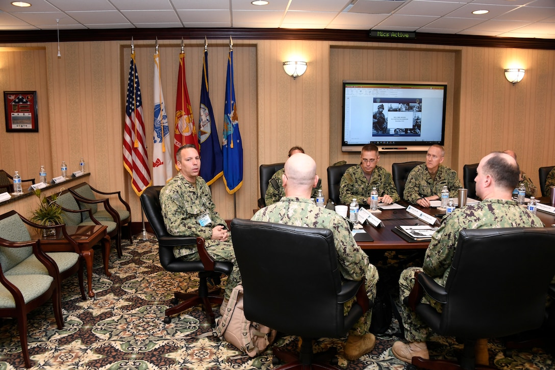Navy Capt. Orlando Lorié, (seated at head of table) new joint team leader for DLA Disposition Services, welcomes attendees to the annual Expeditionary Force Leadership Huddle.
