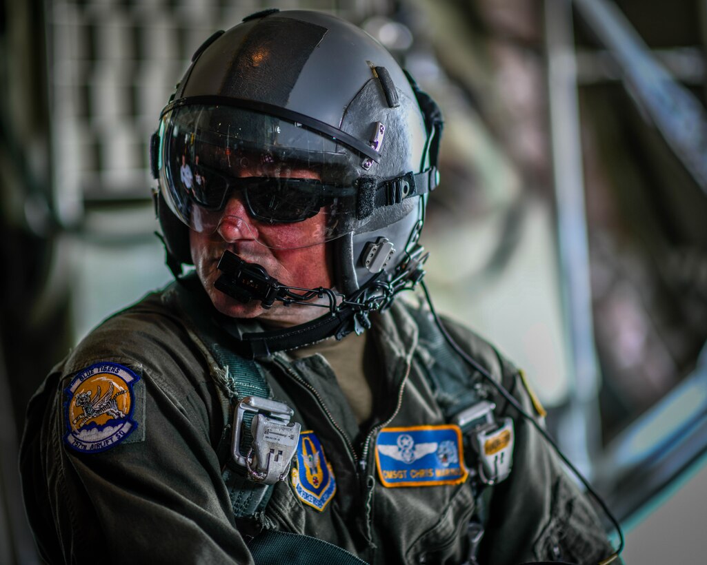 Chief Master Sgt. Christopher Marino, the chief loadmaster for the 757th Airlift Squadron, watches the cargo area of a C-130H Hercules aircraft Aug. 8, 2019, during an orientation flight.