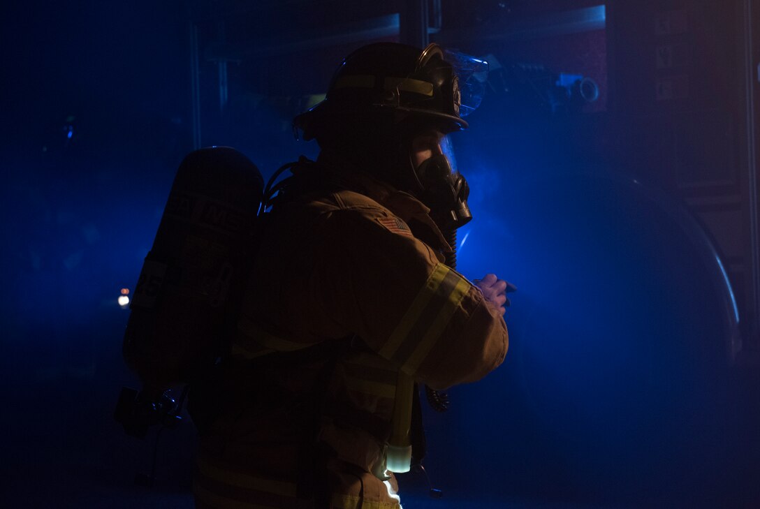 A 86th Civil Engineer Squadron firefighter prepares to respond to a simulated building fire during Exercise Operation Varsity 19-04 at Ramstein Air Base, Germany, Dec. 10, 2019. The simulated fire was one of several practice scenarios that occurred at Ramstein; Lajes Air Base, Portugal; Moron Air Base, Spain; and Chievres Air Base, Belgium, to measure and report unit’s ability to react and respond to contingency in the most realistic environment possible.