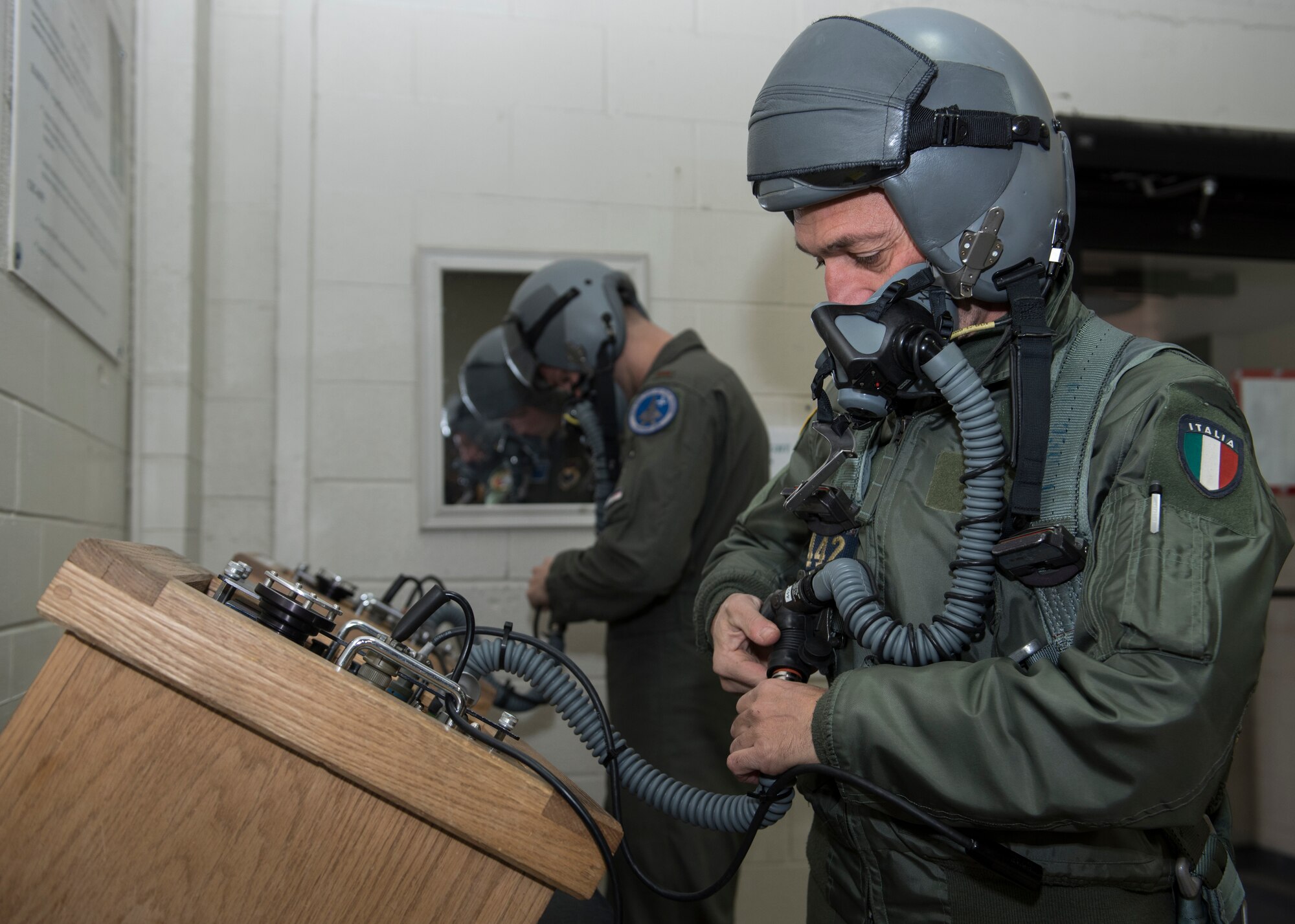 Euro-NATO Joint Jet Pilot Training Program student pilots check their equipment before flying at Sheppard Air Force Base, Texas, Dec. 10, 2019. The pilots get their gear fitted first by the Aircrew Flight Equipment Airmen, but after the initial fitting, they will mostly be gearing up and preparing their equipment themselves. (U.S. Air Force photo by Senior Airman Pedro Tenorio)