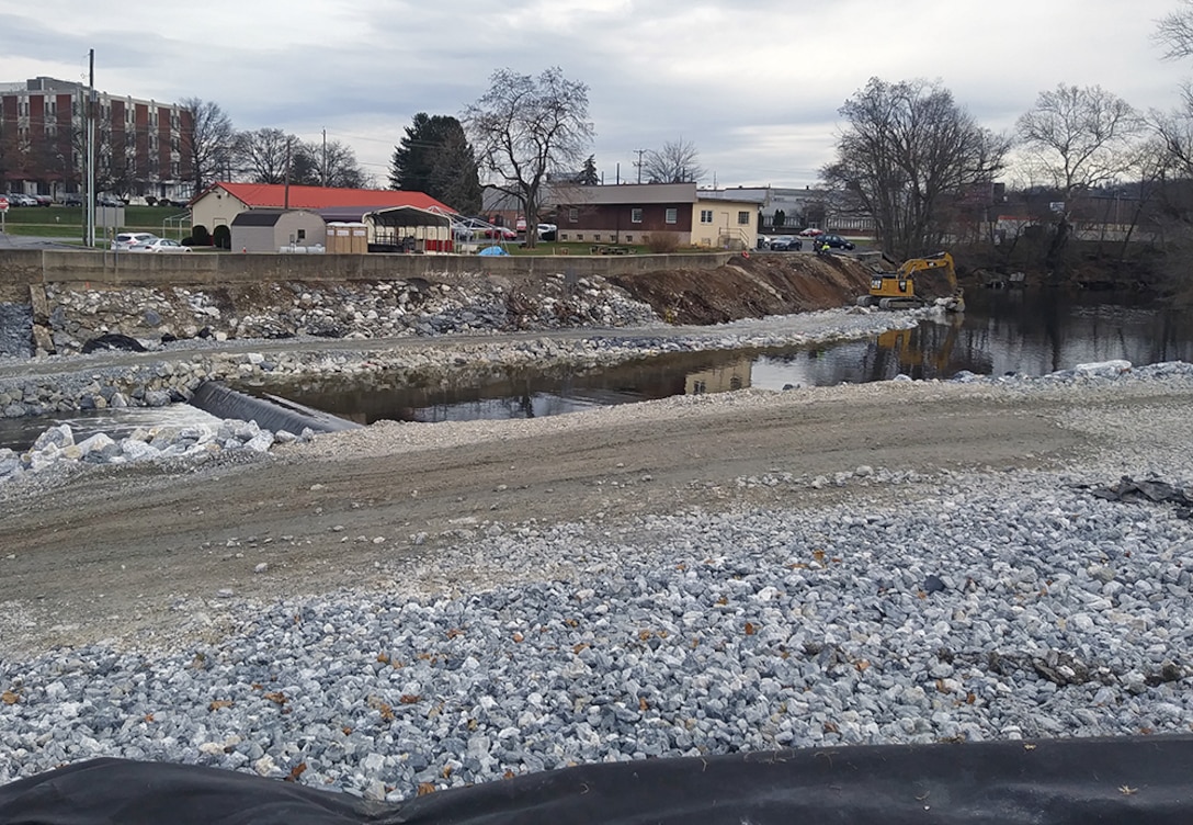 Work underway to install and repair rip rap (large stones placed to prevent erosion) at the upstream end of the southeast Codorus Creek flood risk management project where the York levee system begins until the South Richland Ave. Bridge, in York, Pennsylvania, Dec. 6, 2019. The approximately $2.4 million effort is being performed by contractor Cromedy Construction, a small business out of Philadelphia, and is anticipated to wrap up by spring 2020. (Courtesy Photo)