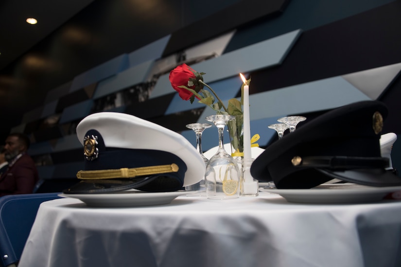 Hats representing different branches of the military rest on a “Missing Man Table” during the 1st Helicopter Squadron's 50th anniversary gala at Joint Base Andrews, Md., Dec. 6, 2019.