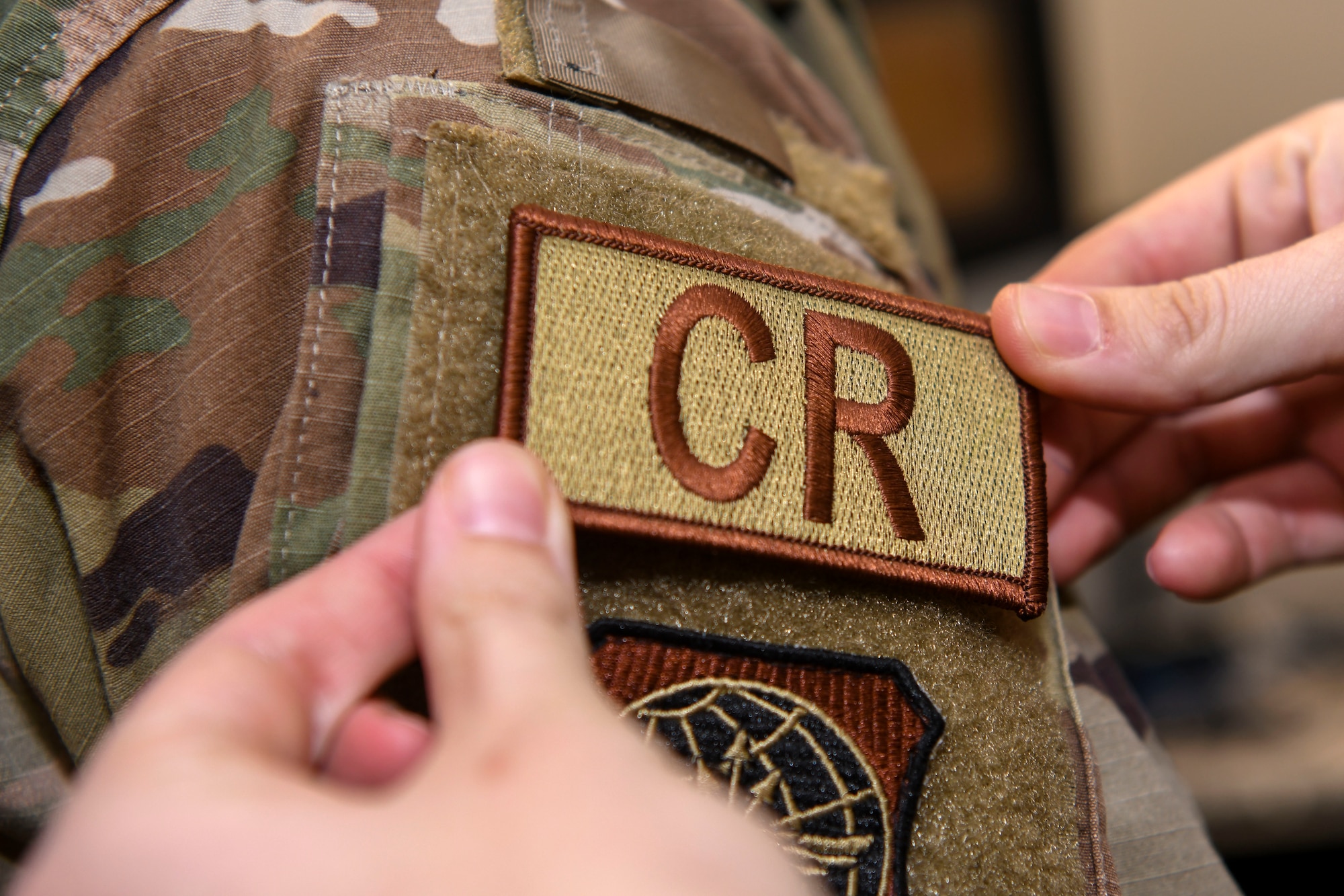 CRW Airmen receive approval to wear 'CR' tabs