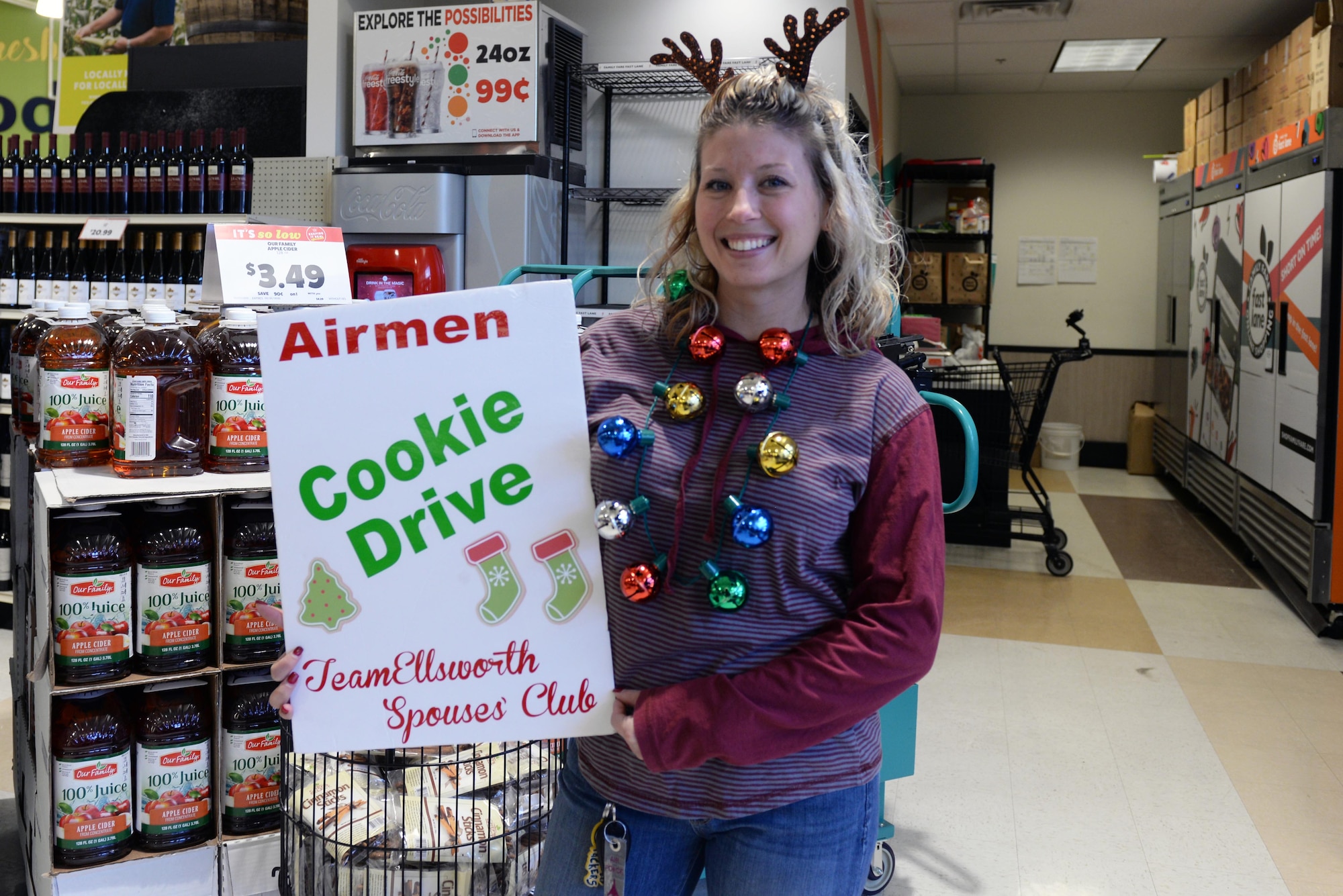 Heather Ryan, the Ellsworth Spouse’s Club Fundraising chairperson, holds a Cookie Drive for dormitory Airmen assigned to Ellsworth Air Force Base, S.D., at the Family Fare Super Market by Baken Park in Rapid City, Dec. 7, 2019. The purpose of the Cookie Drive is to distribute holiday cheer to single Airmen who are away from their families during the holidays. (U.S. Air Force photo by Airman Quentin K. Marx)