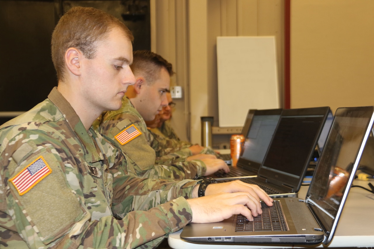 Troops operate computers.
