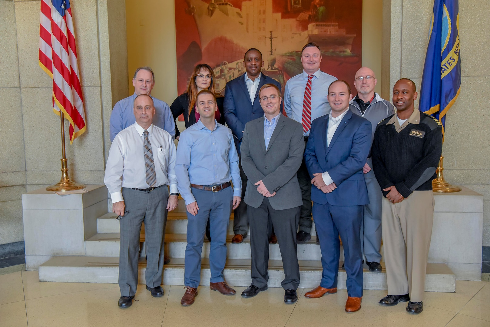 Capt. Cedric McNeal, commanding officer of Naval Surface Warfare Center Carderock Division, recognized a team of engineers from Carderock’s Platform Integrity Department on Dec. 6, 2019, for receiving the Naval Sea Systems Command Technical Authority of the Year Team Award for their contribution in addressing a critical shipbuilding challenge. From left, front row: Technical Director Larry Tarasek, Matthew Sinfield, Kevin Madala, Nate Livesy and McNeal. From left, back row: Paul Young, Maria Posada, Johnnie DeLoach, Charles Roe and Jeff Mercier. (U.S. Navy photo by Harry Friedman/Released)