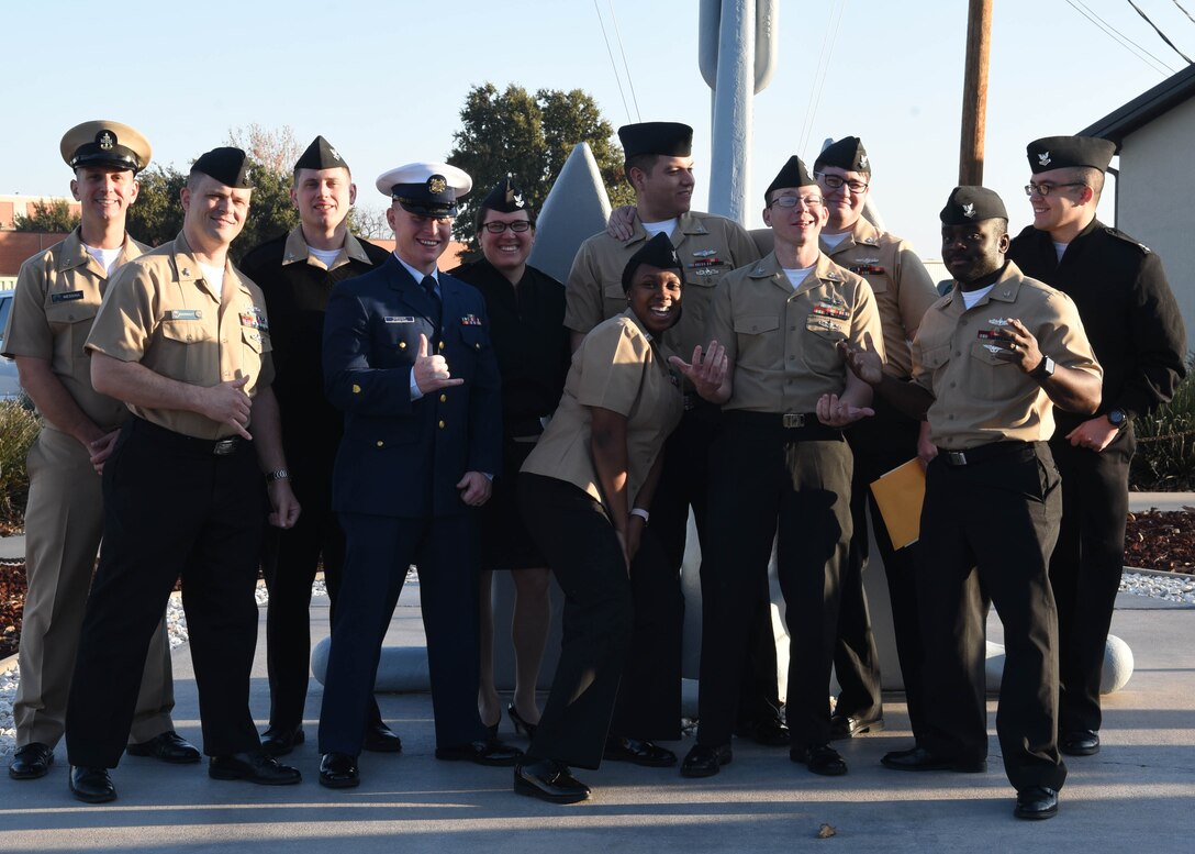 U.S. Navy Analysis and Reporting course graduates pose for a relaxed photo outside of the Center for Information Warfare Training Detachment on Goodfellow Air Force Base, Texas, Dec. 12, 2019. Goodfellow trains all military members in line of its Joint Force mission to develop professionals on behalf of the Department of Defense. (U.S. Air Force photo by Airman 1st Class Abbey Rieves)