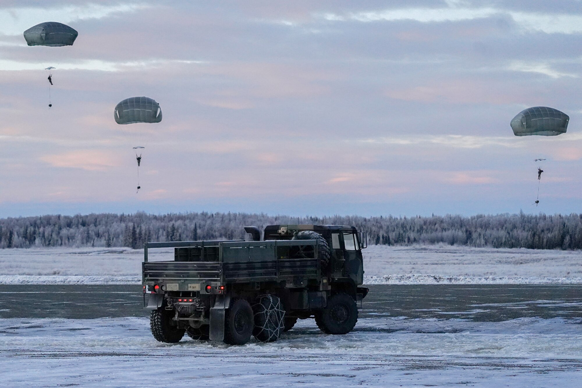 Paratroopers assigned to the 4th Infantry Brigade Combat Team (Airborne), 25th Infantry Division, U.S. Army Alaska, conduct a parachute jump on Malemute drop zone at Joint Base Elmendorf-Richardson, Alaska, Dec. 11, 2019. The Soldiers are part of the Army’s only Pacific airborne brigade with the ability to rapidly deploy worldwide, and are trained to conduct military operations in austere conditions.