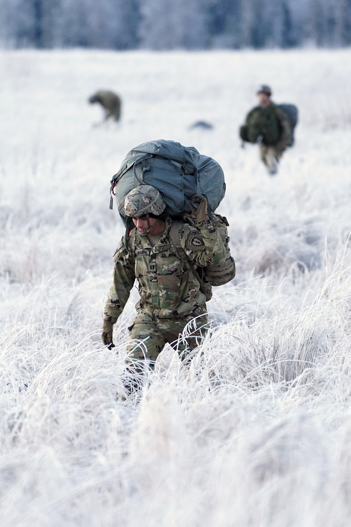 Army Capt. Edgar Burgos, assigned to the 3rd Battalion, 509th Parachute Infantry Regiment, 4th Infantry Brigade Combat Team (Airborne), 25th Infantry Division, U.S. Army Alaska, makes his way to a rally point after conducting a parachute jump on Malemute drop zone at Joint Base Elmendorf-Richardson, Alaska, Dec. 11, 2019. The Soldiers are part of the Army’s only Pacific airborne brigade with the ability to rapidly deploy worldwide, and are trained to conduct military operations in austere conditions.