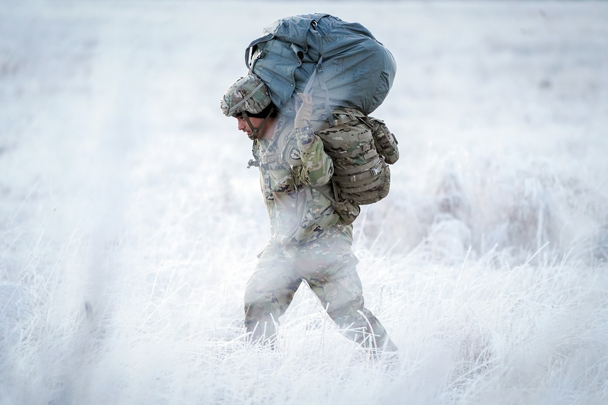 Army Capt. Edgar Burgos, assigned to the 3rd Battalion, 509th Parachute Infantry Regiment, 4th Infantry Brigade Combat Team (Airborne), 25th Infantry Division, U.S. Army Alaska, makes his way to a rally point after conducting a parachute jump on Malemute drop zone at Joint Base Elmendorf-Richardson, Alaska, Dec. 11, 2019. The Soldiers are part of the Army’s only Pacific airborne brigade with the ability to rapidly deploy worldwide, and are trained to conduct military operations in austere conditions.