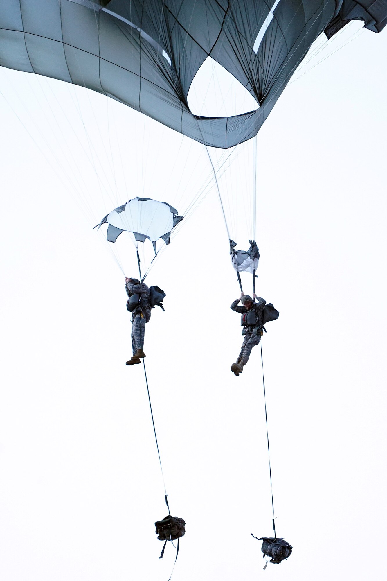 Paratroopers assigned to the 4th Infantry Brigade Combat Team (Airborne), 25th Infantry Division, U.S. Army Alaska, conduct a parachute jump on Malemute drop zone at Joint Base Elmendorf-Richardson, Alaska, Dec. 11, 2019. The Soldiers are part of the Army’s only Pacific airborne brigade with the ability to rapidly deploy worldwide, and are trained to conduct military operations in austere conditions.