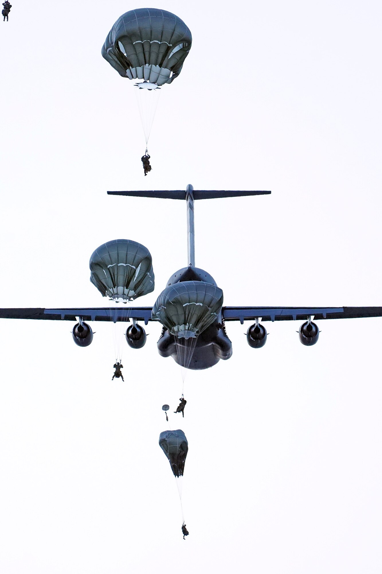 Paratroopers assigned to the 4th Infantry Brigade Combat Team (Airborne), 25th Infantry Division, U.S. Army Alaska, conduct a parachute jump on Malemute drop zone at Joint Base Elmendorf-Richardson, Alaska, Dec. 11, 2019. The Soldiers are part of the Army’s only Pacific airborne brigade with the ability to rapidly deploy worldwide, and are trained to conduct military operations in austere conditions.