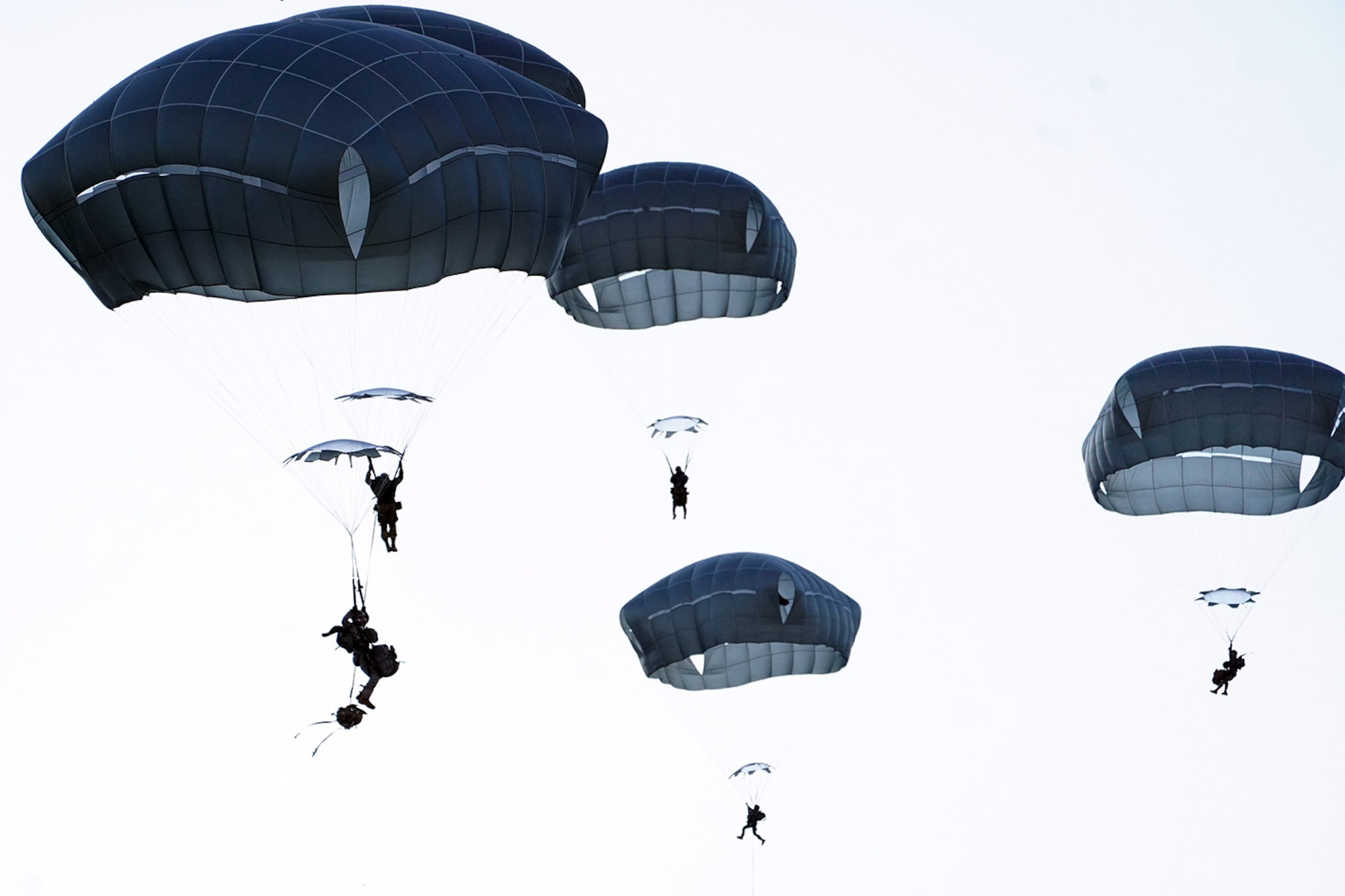 Paratroopers assigned to the 4th Infantry Brigade Combat Team (Airborne), 25th Infantry Division, U.S. Army Alaska, conduct a parachute jump on Malemute drop zone at Joint Base Elmendorf-Richardson, Alaska, Dec. 11, 2019. The Soldiers are part of the Army’s only Pacific airborne brigade with the ability to rapidly deploy worldwide, and are trained to conduct military operations in austere conditions.