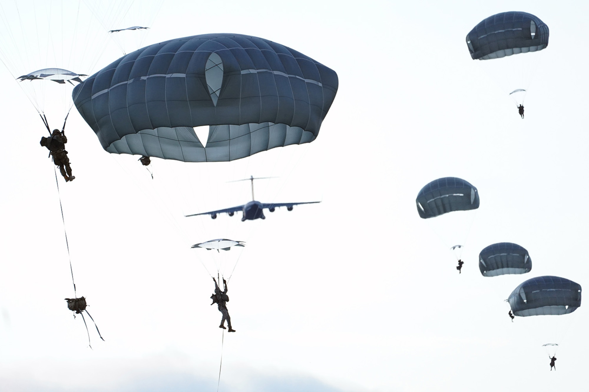 Paratroopers assigned to the 4th Infantry Brigade Combat Team (Airborne), 25th Infantry Division, U.S. Army Alaska, conduct a parachute jump on Malemute drop zone at Joint Base Elmendorf-Richardson, Alaska, Dec. 11, 2019. The Soldiers are part of the Army’s only Pacific airborne brigade with the ability to rapidly deploy worldwide, and are trained to conduct military operations in austere conditions.