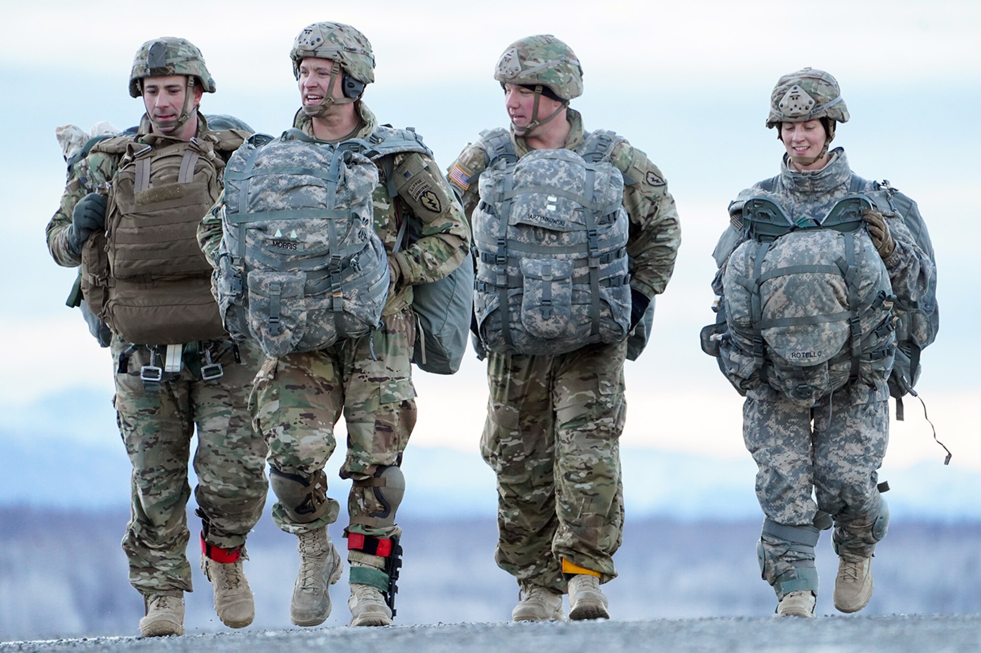 Soldiers assigned to the 4th Infantry Brigade Combat Team (Airborne), 25th Infantry Division, U.S. Army Alaska, makes their way to a rally point after conducting a parachute jump on Malemute drop zone at Joint Base Elmendorf-Richardson, Alaska, Dec. 11, 2019. The Soldiers are part of the Army’s only Pacific airborne brigade with the ability to rapidly deploy worldwide, and are trained to conduct military operations in austere conditions.