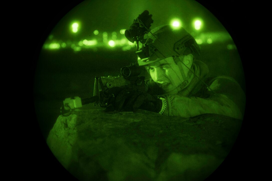 A Defender assigned to the 86th Security Forces Squadron takes a defensive position during a simulated ground attack at Ramstein Air Base, Germany, Dec. 11, 2019. During the scenario, 16 simulated oppositon personnel bearing small-arms simulated a breach in Ramstein’s perimeter fence. 86th SFS personnel were evaluated on their response tatics, techniques and procedures.