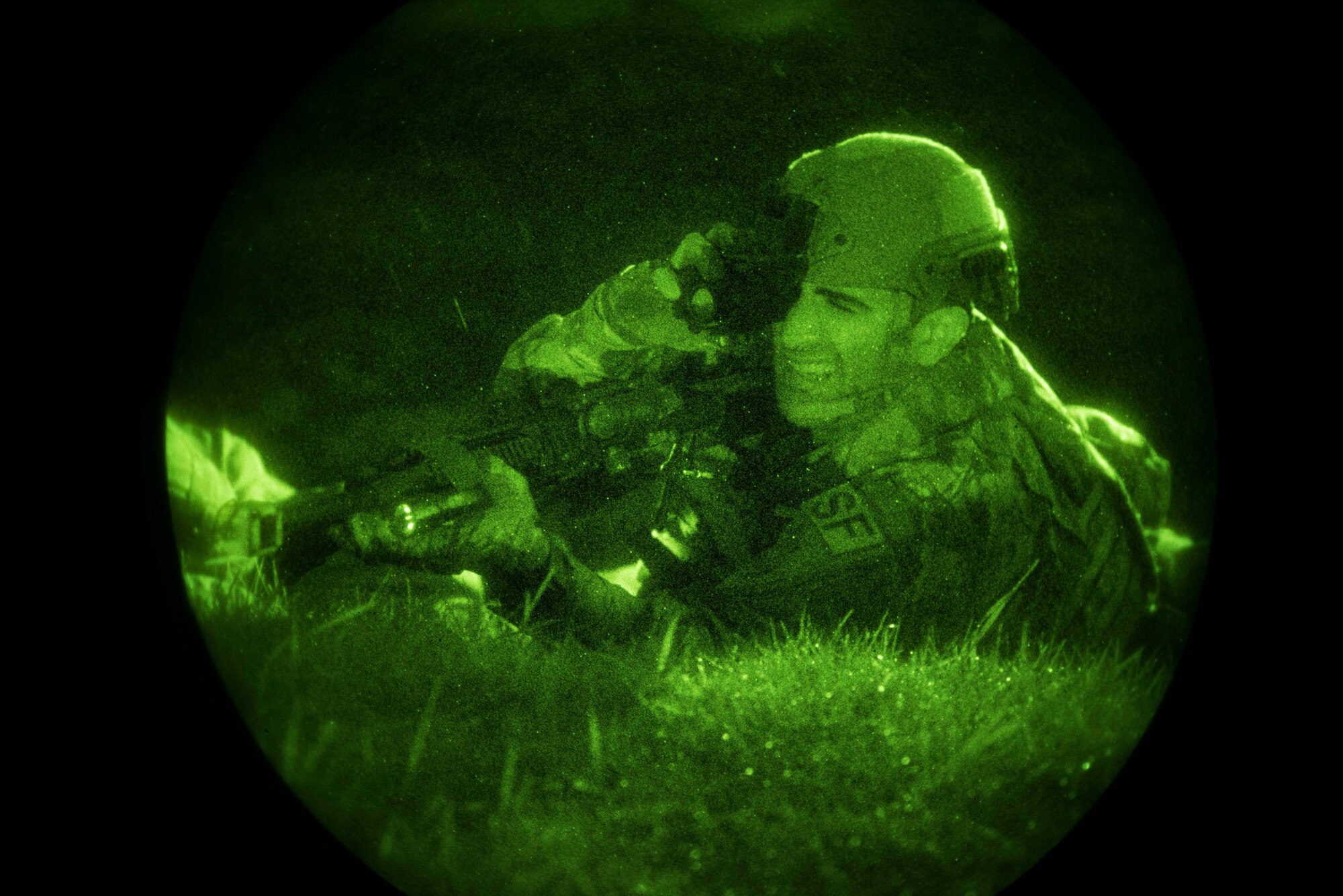A 86th Security Forces Squadron defender adjusts his night vision monocular during a simulated ground attack at Ramstein Air Base, Germany, Dec. 11, 2019. Under weather conditions of rain and near-freezing tempuratures, 86th SFS personel followed their training by fortifying and defending their postions, and requesting additional forces.