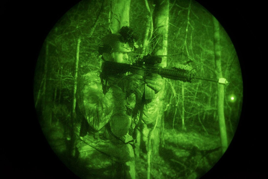 A Defender assigned to the 86th Security Forces Squadron clears the area of simulated aggressors during an exercise ground attack at Ramstein Air Base, Germany, Dec. 11, 2019. The objective of the simulation was to evaluate the ability of the 86th SFS to defend against small arms threats. The scenario was part of Exercise Operation Varsity 19-04, which included exercises at Ramstein; Lajes Air Base; Portugal; Moron Air Base; Spain; and Chievres Air Base, Belgium.