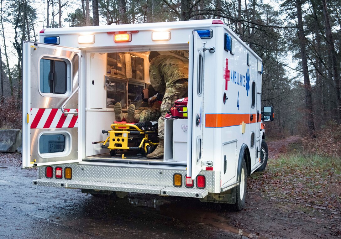U.S. Air Force Airmen assigned to the 86th Medical Group secure a simulated car crash victim inside an ambulance during Exercise Operation Varsity 19-04 at Ramstein Air Base, Germany, Dec. 12, 2019. Emergency response personnel were tested on their ability to respond to the situation in a timely manner, assess the victim’s injuries and transport her to an ambulance.