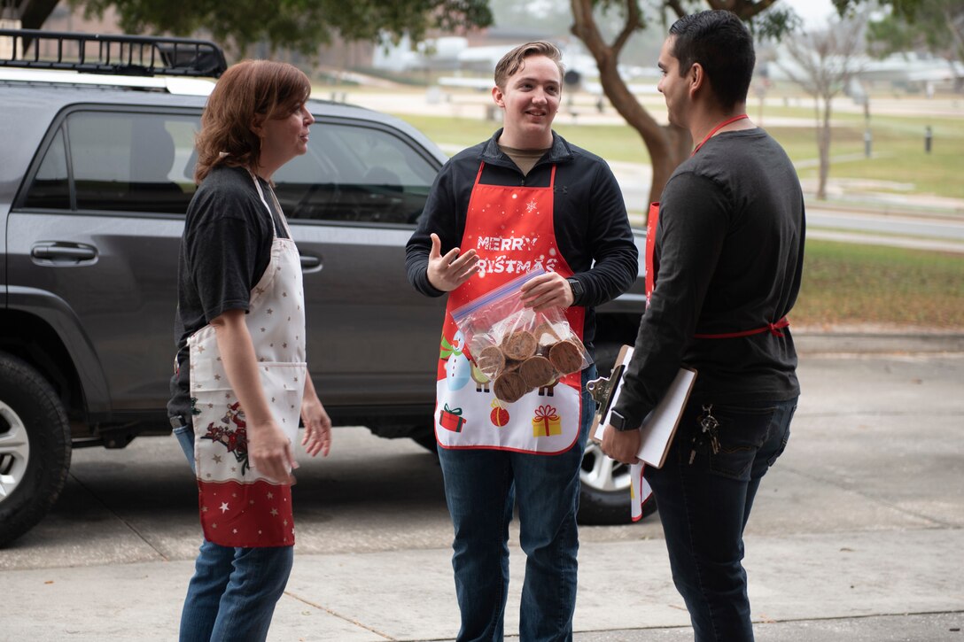 A photo of volunteers of the Moody Air Force Base Airmen Cookie Drive receiving donated cookies.