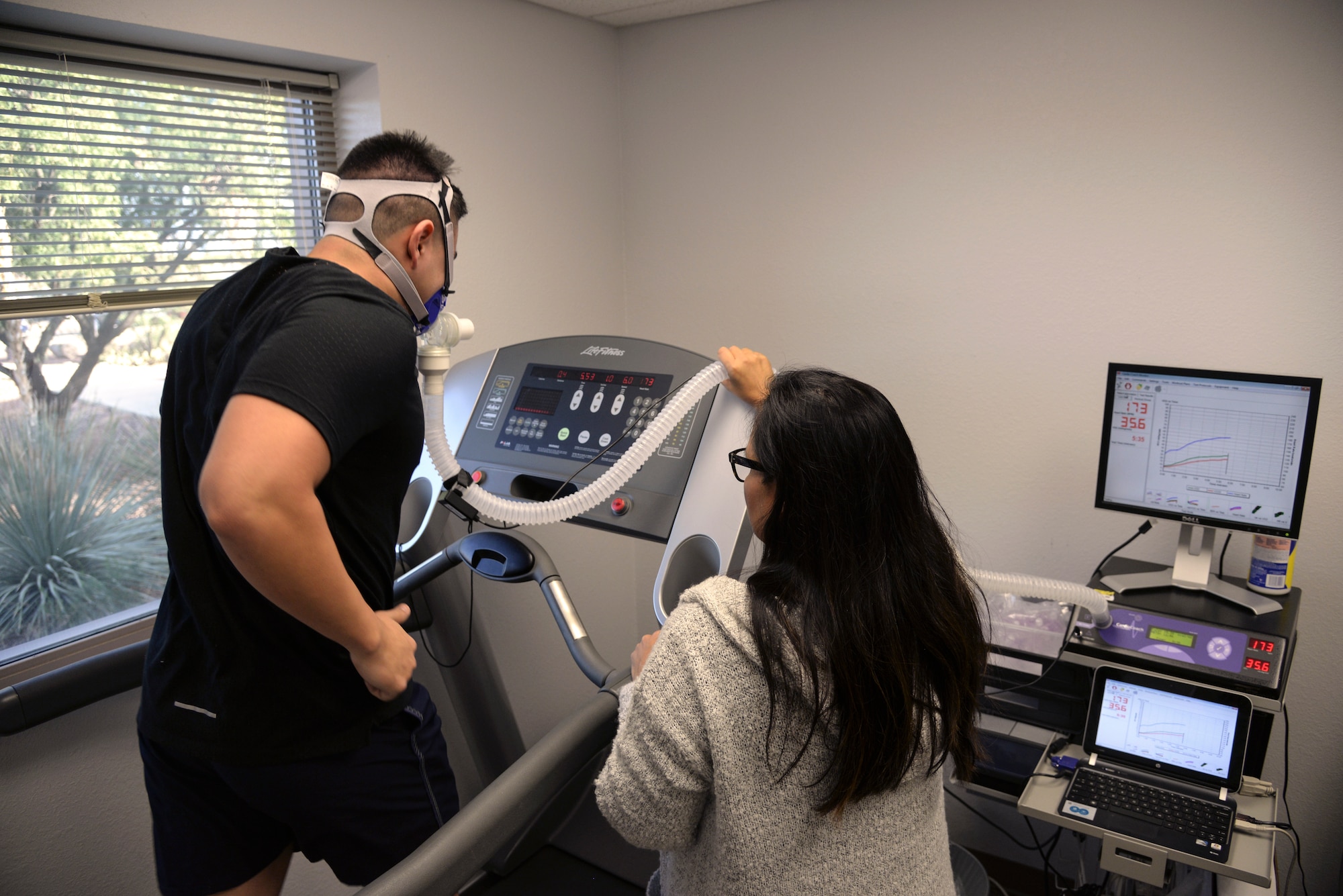 Photo of a person running on a cardio testing treadmill