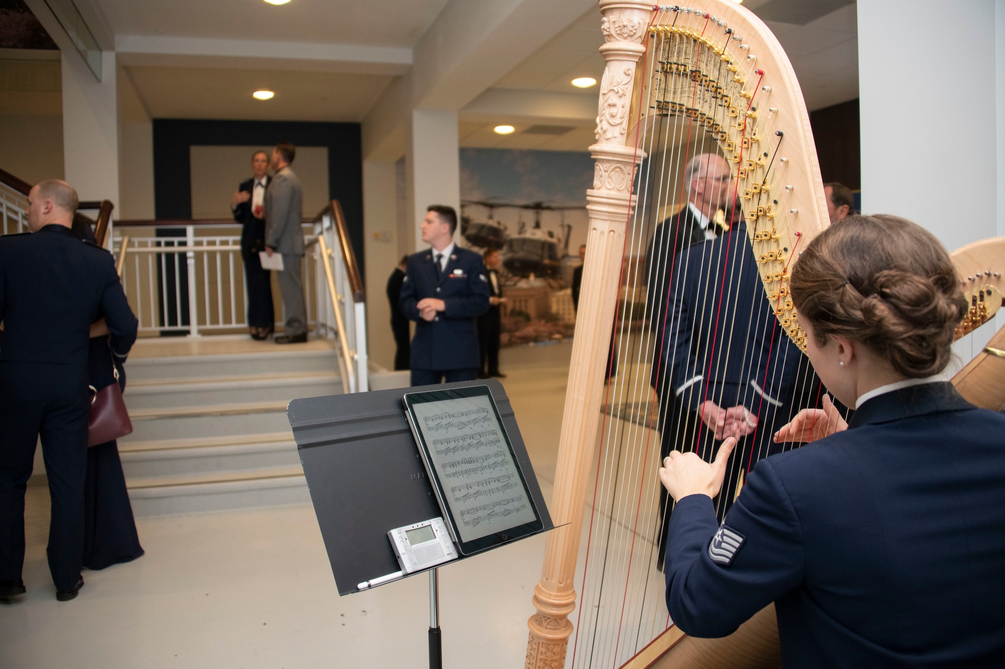 U.S. Air Force Tech. Sgt. Gréta K. Ásgeirsson, a U.S. Air Force Band principal harpist, plays during the opening of the 1st Helicopter Squadron’s 50th anniversary gala at Joint Base Andrews, Md., Dec. 6, 2019.
