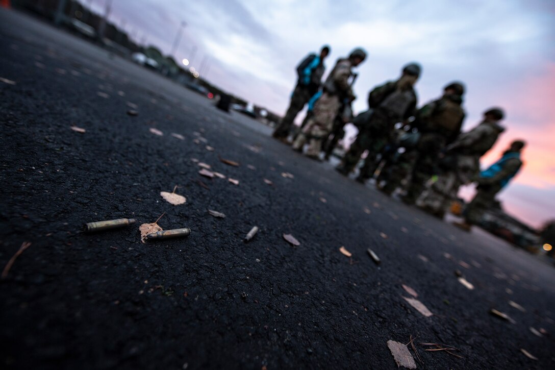 U.S. Air Force Airmen assigned to the 569th U.S. Forces Police Squadron listen to feedback from Wing Inspection Team members after a simulated ground attack as part of exercise Operation Varsity 19-04 at Kapaun Air Station, Germany, Dec. 11, 2019. Feedback is essential to honing techniques and processes during Ramstein’s quarterly exercises. (U.S. Air Force photo by Staff Sgt. Devin Boyer)