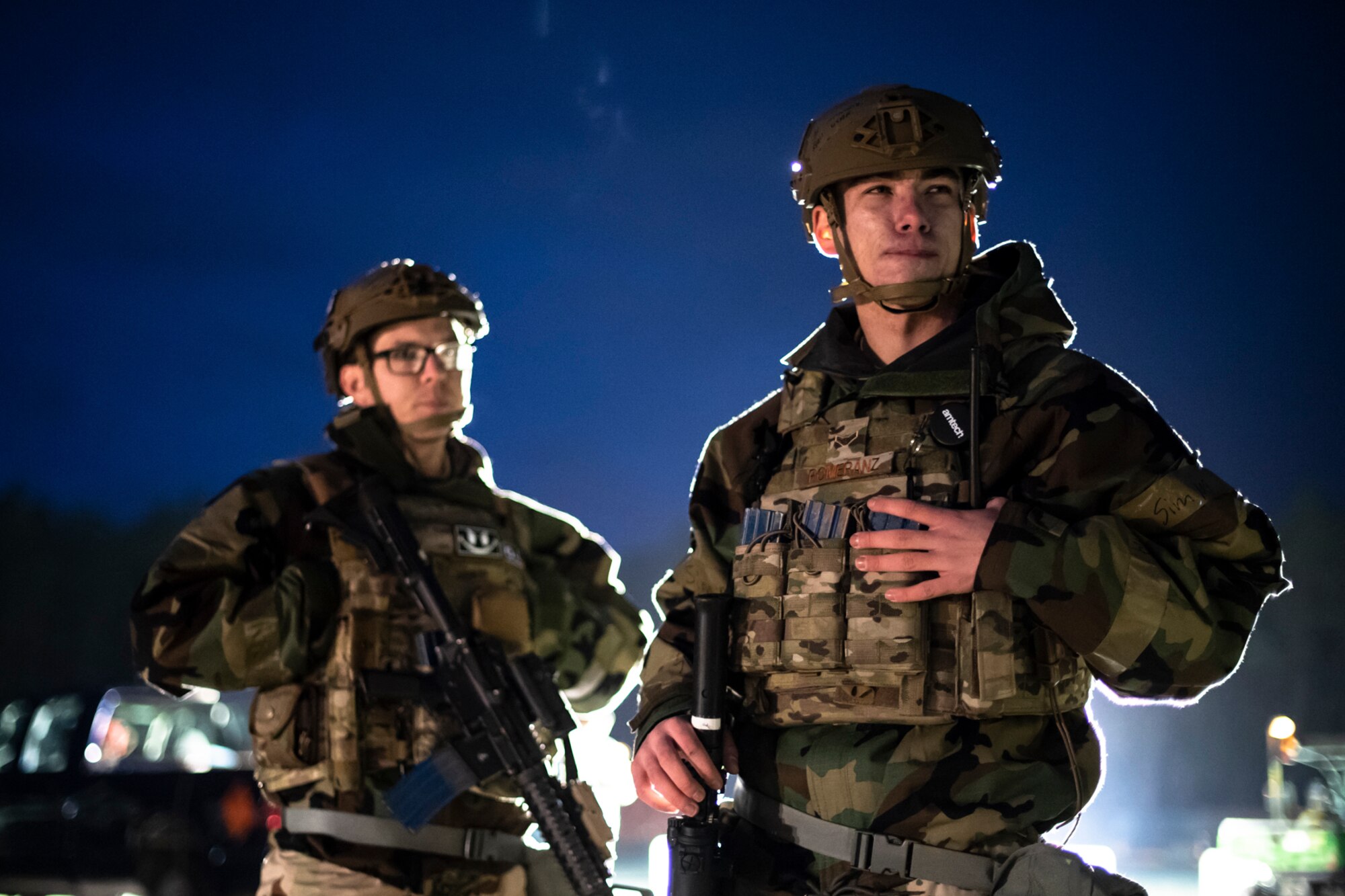 U.S. Air Force Staff Sgt. Cameron Husted, left, and Airman 1st Class Ryan Pomeranz, 569th U.S. Forces Police Squadron members, listen to instructions regarding a simulated ground attack during exercise Operation Varsity 19-04 at Kapaun Air Station, Germany, Dec. 11, 2019. The ground attack was an impromptu test for defenders to secure the installation. (U.S. Air Force photo by Staff Sgt. Devin Boyer)