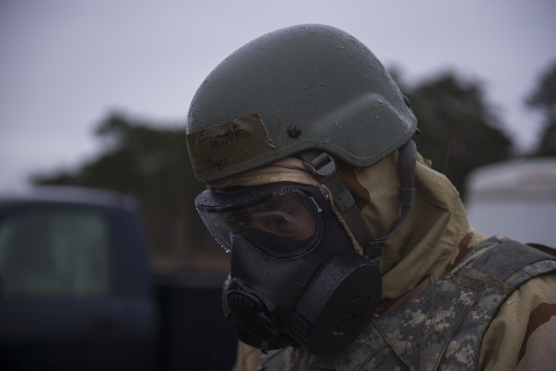 U.S. Air Force Senior Airman Erickson Zinger, 786th Civil Engineer Squadron emergency management training journeyman, instructs Airmen on the procedures to decontaminate and remove their Mission-Oriented Protective Posture gear at Ramstein Air Base, Germany, Dec. 11, 2019. The contamination control area allowed personnel to safely remove their gear and transition to non-contaminated areas during exercise Operation Varsity 19-04. (U.S. Air Force Photo by Senior Airman Kaylea Berry)