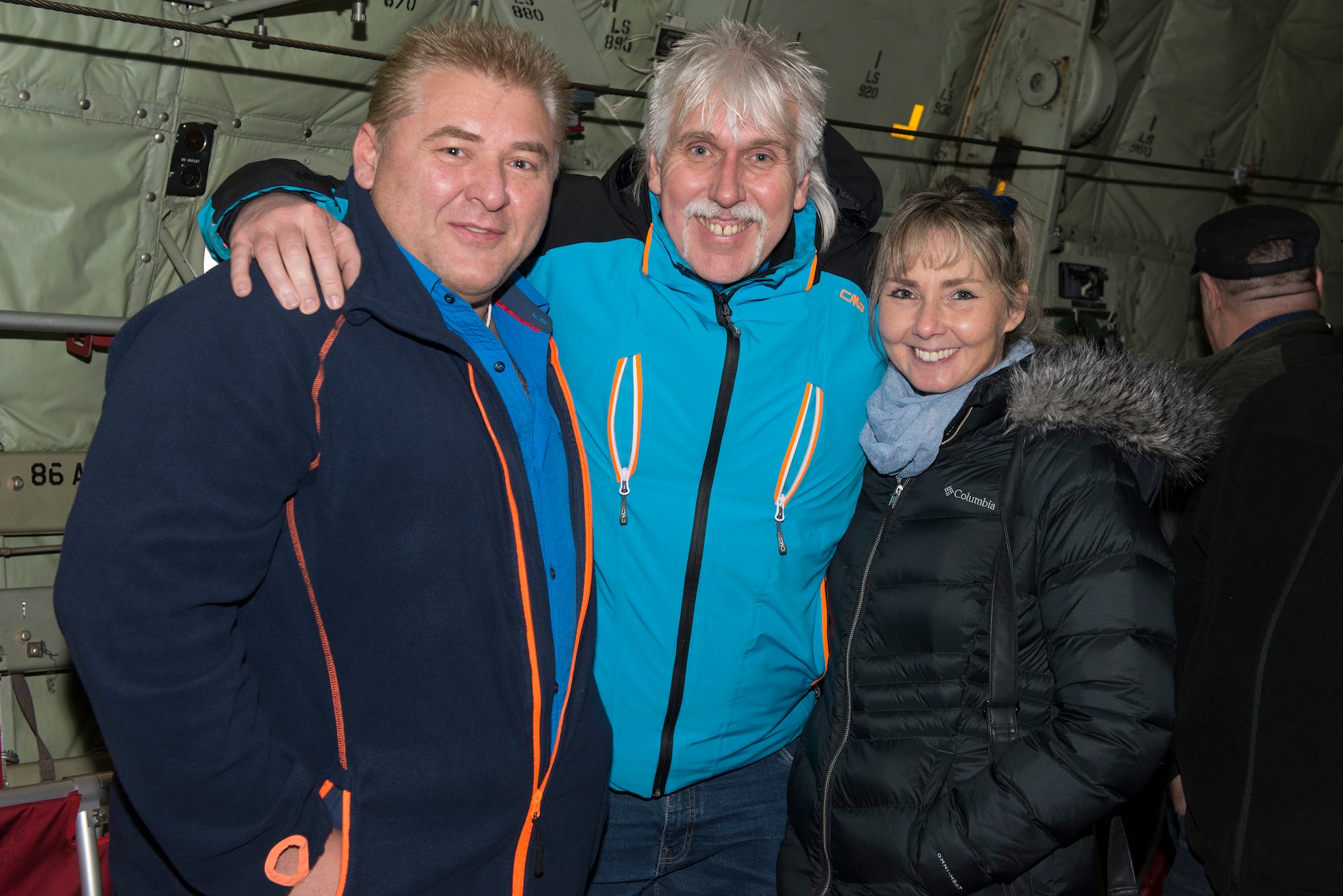 Volker Ernst, left, a 30-year length-of-service honoree, poses for a photo with his family inside a C-130J Hercules aircraft at Ramstein Air Base, Germany, Dec. 6, 2019. Ernst was one of more than 150 civil servants honored earlier in the day for long-standing employment with the U.S. government.  American and non-U.S. employees play a vital role in maintaining Ramstein Air Base’s mission and capabilities.