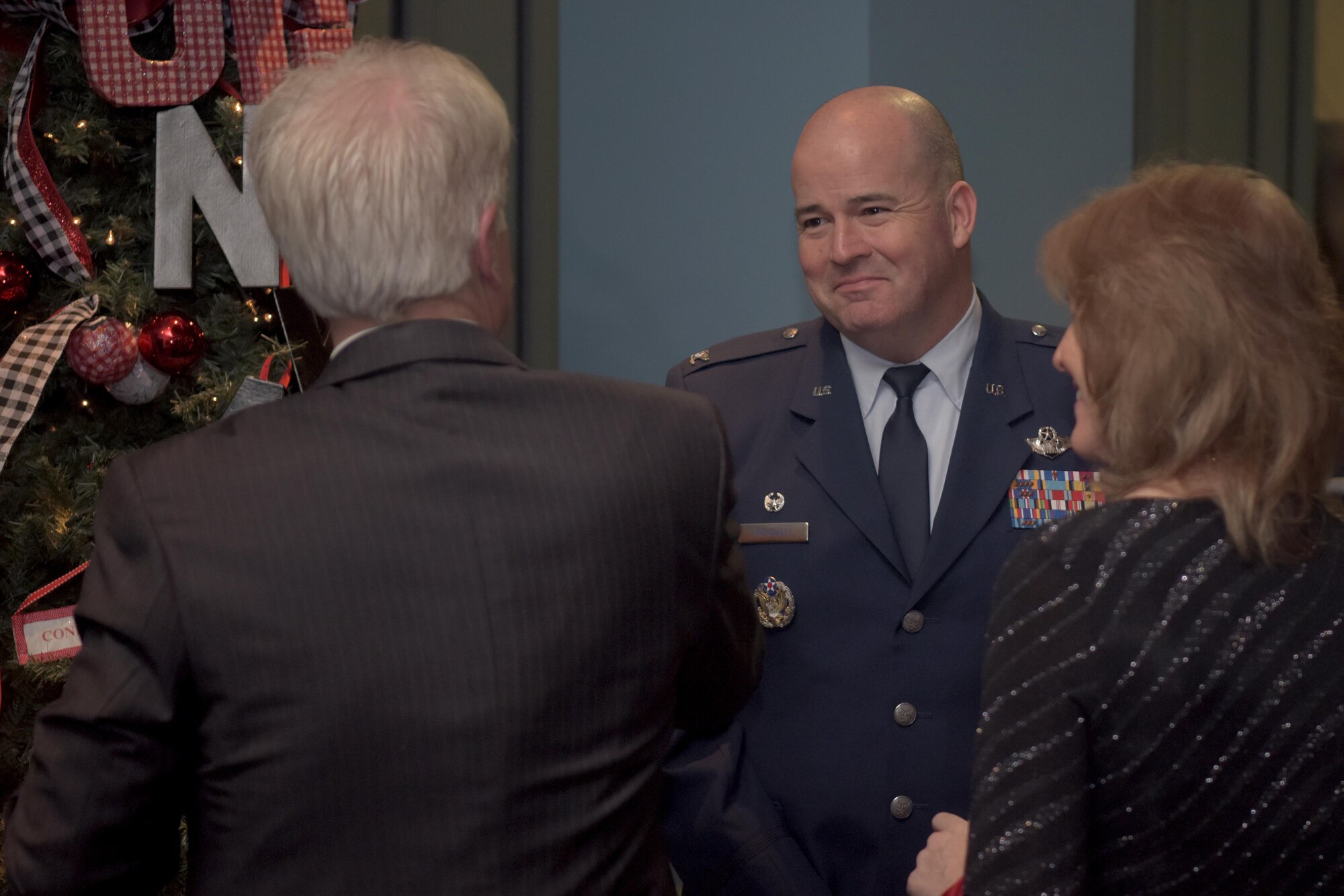 Col. William Marshshall, 48th Fighter Wing commander, speaks with community leaders during the 2019 Yuletide Reception at the Galaxy Club, RAF Mildenhall, Dec. 6, 2019. The Yuletide reception served to highlight the mutually beneficial relationship between the military and local communities. (U.S. Air Force photo by Senior Airman Benjamin Cooper)